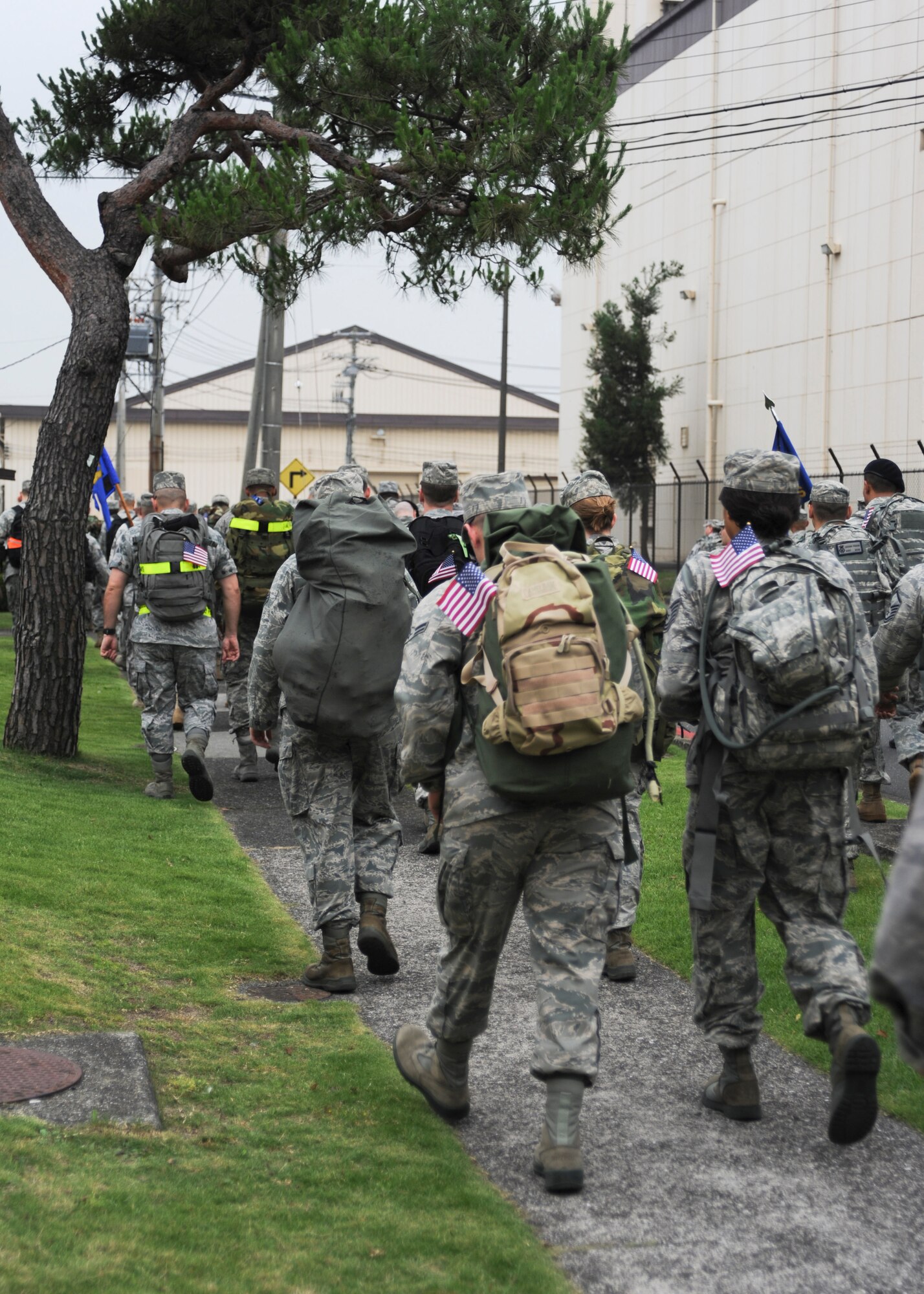 YOKOTA AIR BASE, Japan -- Yokota members kick off a ruck march in honor the U.S. Army's 236th birthday Yokota Air Base, Japan, June 14, 2011. Approximately 100 active-duty servicemembers and family participated in the seven-mile march around the base. (U.S. Air Force photo/Senior Airman Andrea Salazar)