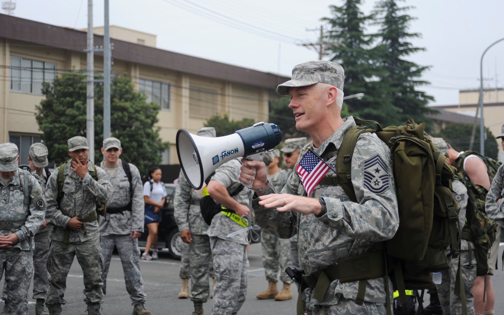 YOKOTA AIR BASE, Japan -- Command Chief Master Sgt. Richard Kaiser, U.S. Forces Japan and Fifth Air Force command chief, gives an opening speech to members prior to a ruck march honoring the U.S. Army's birthday, Yokota Air Base, Japan, June 14, 2011. Yokota Airmen, Soldiers, Marines and civilians participated in the march, each carrying a minimum of 30 pounds. (U.S. Air Force photo/Senior Airman Andrea Salazar)