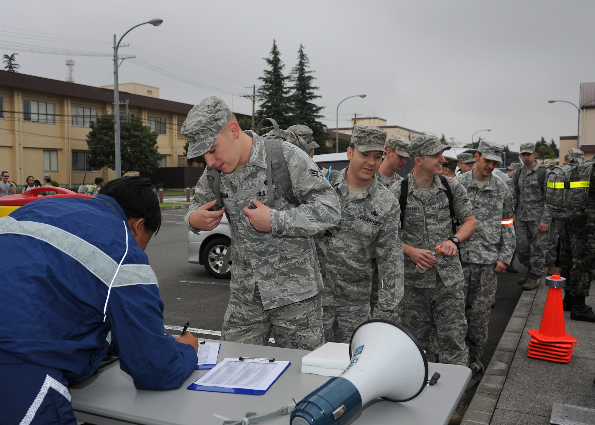 YOKOTA AIR BASE, Japan -- Yokota members sign in for a ruck march honoring the U.S. Army's 236th birthday at Yokota Air Base, Japan, June 14, 2011. Approximately 100 people signed up to participate in the seven-mile march around the base. (U.S. Air Force photo/Senior Airman Andrea Salazar)