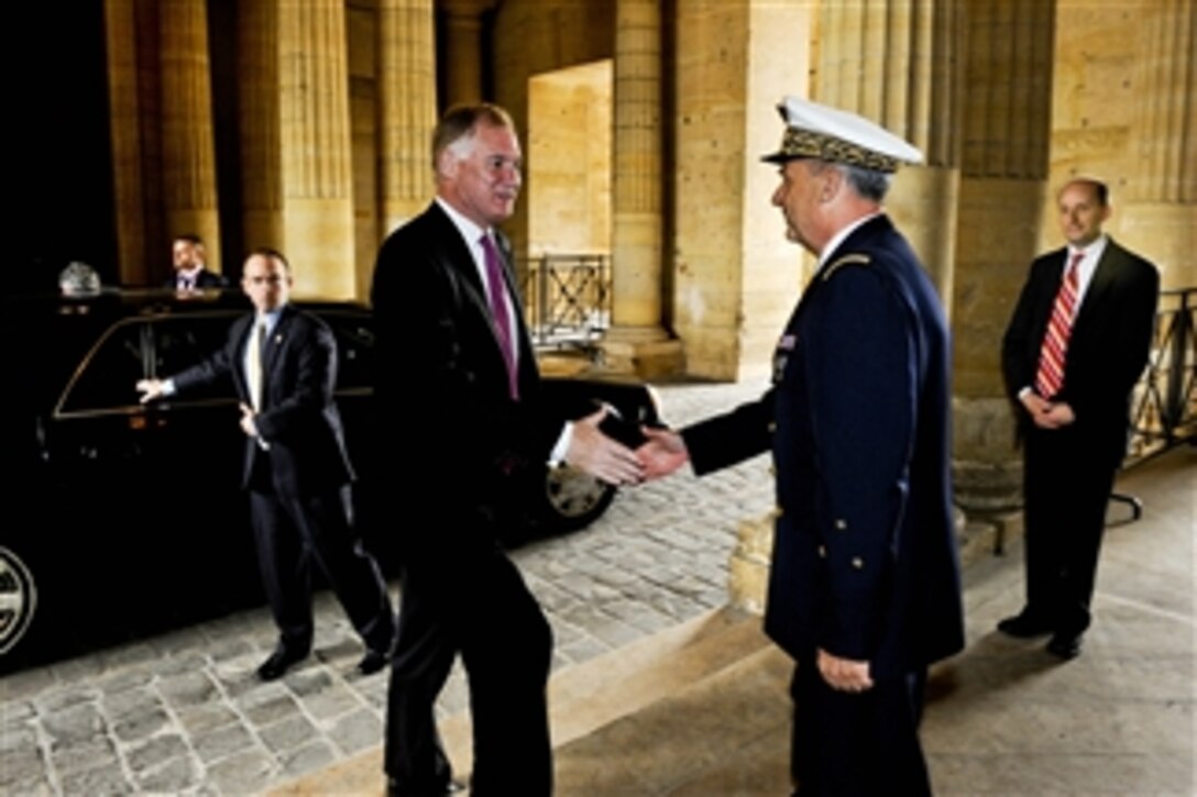 French Air Force Maj. Gen. Gratien Maire greets Deputy Secretary of Defense William J. Lynn III as he arrives at the Ecole Militaire in Paris on June 17, 2011.  Lynn was to meet with French defense leaders to receive an update on NATO operations in Libya.  
