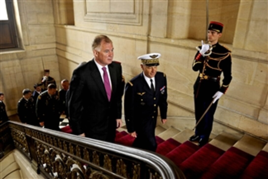 French Air Force Maj. Gen. Gratien Maire escorts Deputy Secretary of Defense William J. Lynn III at the Ecole Militaire in Paris on June 17, 2011.  Lynn was to meet with French defense leaders to receive an update on NATO operations in Libya.  