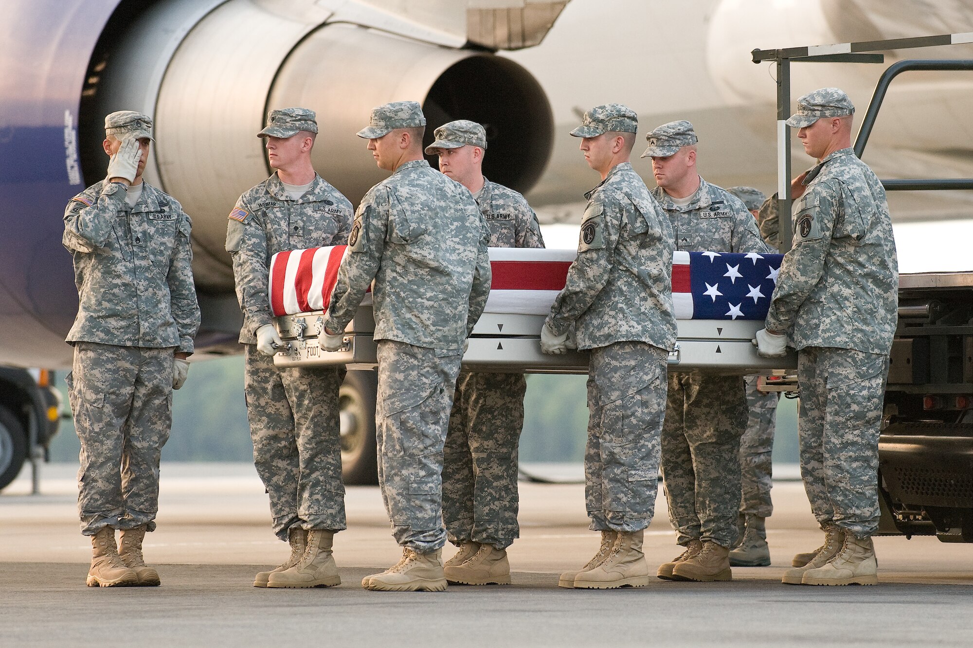 A U.S. Army carry team transfers the remains of Army Spc. Scott D. Smith, of Indianapolis, Ind., at Dover Air Force Base, Del., June 21, 2011. Smith was assigned to the 81st Troop Command, Indiana Army National Guard, Indianapolis, Ind. (U.S. Air Force photo/Roland Balik)