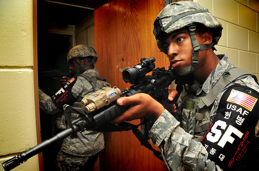 51st Security Forces quick reaction team clear an empty room, June 20 at Osan Air Base, Republic of Korea. Security Forces are responsible for ensuring the safety of bases, weapons, property and personnel from hostile forces. (U.S. Air Force Photo by Staff Sgt. Daylena Gonzalez)