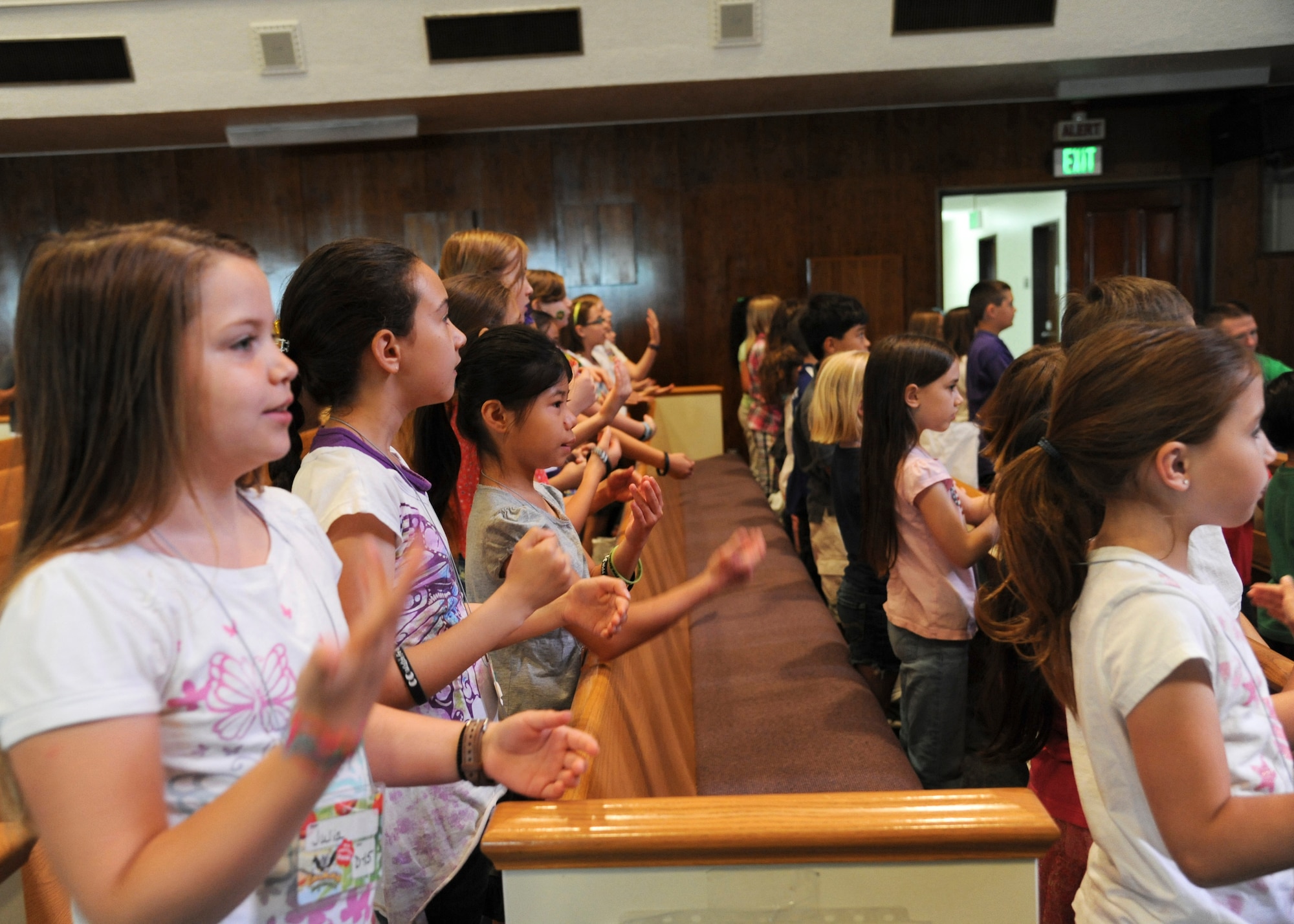 YOKOTA AIR BASE, Japan -- Children sing praise songs during the annual weeklong vacation bible school June 21, 2011, Yokota Air Base, Japan. Approximately 100 children from the base's Protestant and Orthodox Christian communities participated together in bible lessons, crafts, dancing and singing. (U.S. Air Force photo/Senior Airman Andrea Salazar)