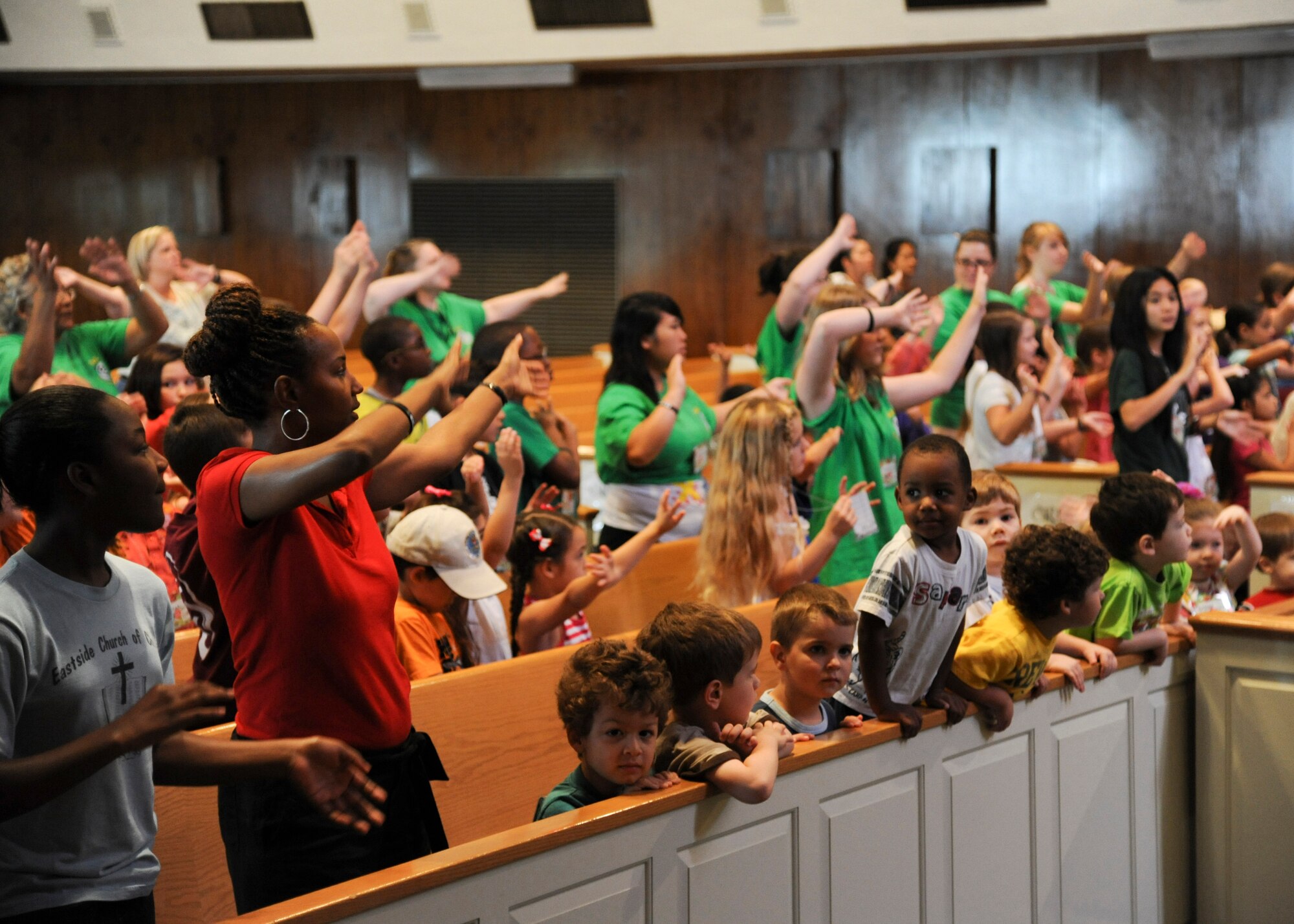 YOKOTA AIR BASE, Japan -- Yokota children and chapel volunteers sing and dance during the annual vacation bible school week held at the traditional base chapel June 21, 2011, Yokota Air Base, Japan. The weeklong program is hosted by the base chapel's religious education for children program as a cooperative effort for Catholic, Protestant and Orthodox Christian communities. (U.S. Air Force photo/Senior Airman Andrea Salazar)