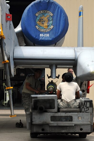 KUNSAN AIR BASE, Republic of Korea -- 355th Aircraft Maintenance Squadron load crew members use an MJ1 bomb lift truck to load a weapon onto an A-10 Thunderbolt II during the semi-annual Weapons Loading Competition here June 18. The 355th AMS is temporarily assigned here from Davis-Monthan Air Force Base, Airz. Five teams, with three members each, represented Kunsan and Osan Air Bases, Davis-Monthan AFB and Royal Air Force Lakenheath, England, as well as the Republic of Korea Air Force 38th Fighter Group from Kunsan AB. (U.S. Air Force photo/Senior Airman Brittany Y. Bateman)