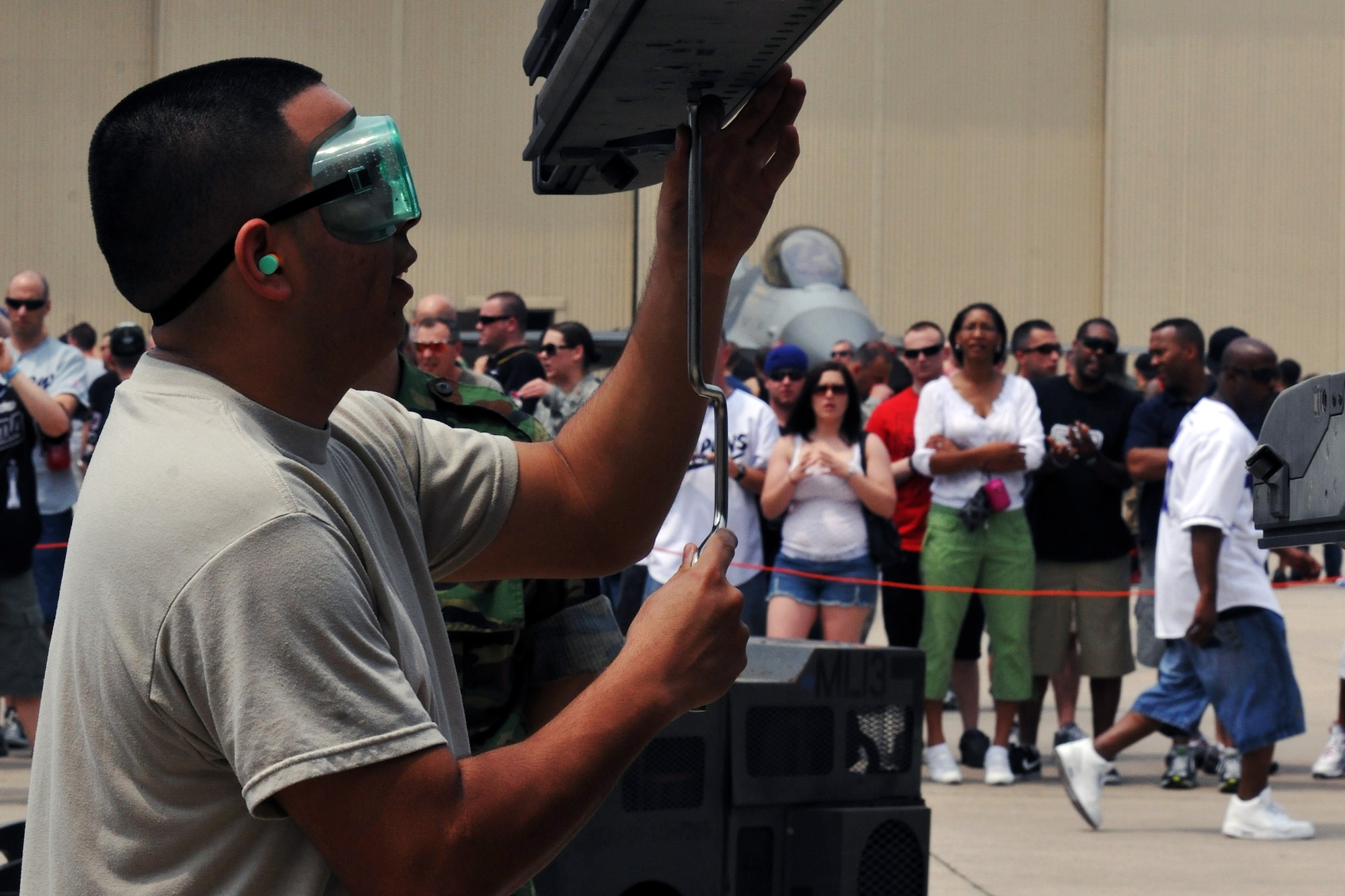 KUNSAN AIR BASE, Republic of Korea -- Staff Sgt. Alfred Beas, 8th Aircraft Maintenance Squadron load crew member, participates in the semi-annual Weapons Loading Competition here June 18. The next load competition is scheduled for this fall at Osan AB. (U.S. Air Force photo/Senior Airman Brittany Y. Bateman)