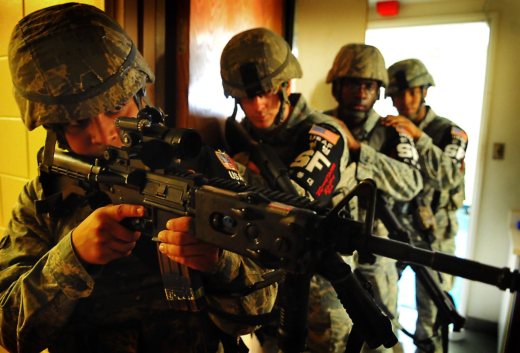 51st Security Forces members clear an empty room June 20 at Osan Air Base, Republic of Korea.  Security Forces is responsible for ensuring the safety of bases, weapons, property and personnel from hostile forces.  (U.S. Air Force Photo by Senior Airman Evelyn Chavez)