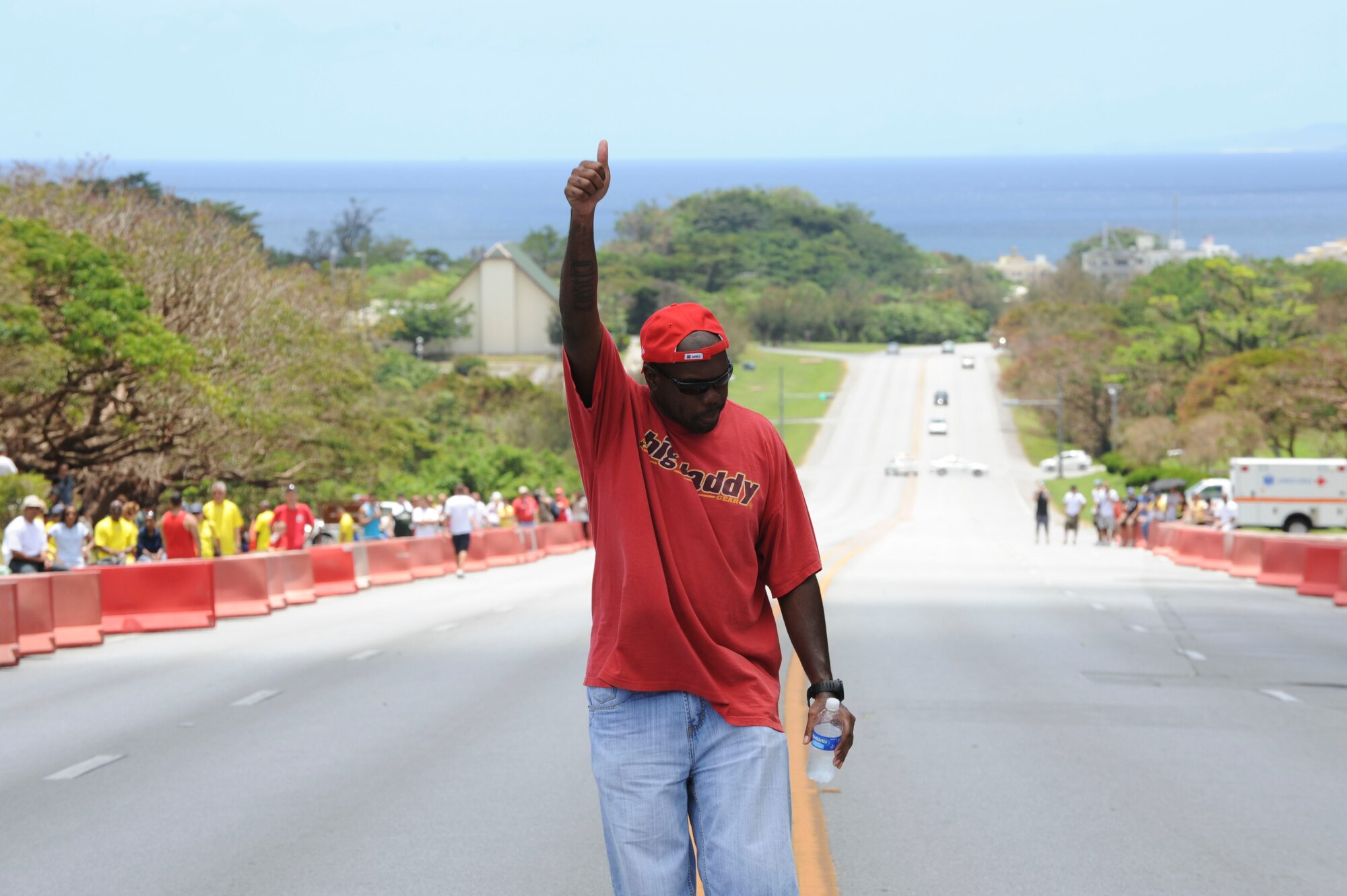 Tech. Sgt. Raynard Brooks, Airman and Family Readiness Center, gives the signal for the derby cars to speed off at the Kadena American Red Cross’s Derby Days, June 18. $2,750 was raised for the Red Cross to help to help local volunteer service. (U.S. Air Force photo/Airman 1st Class Brooke P. Beers)