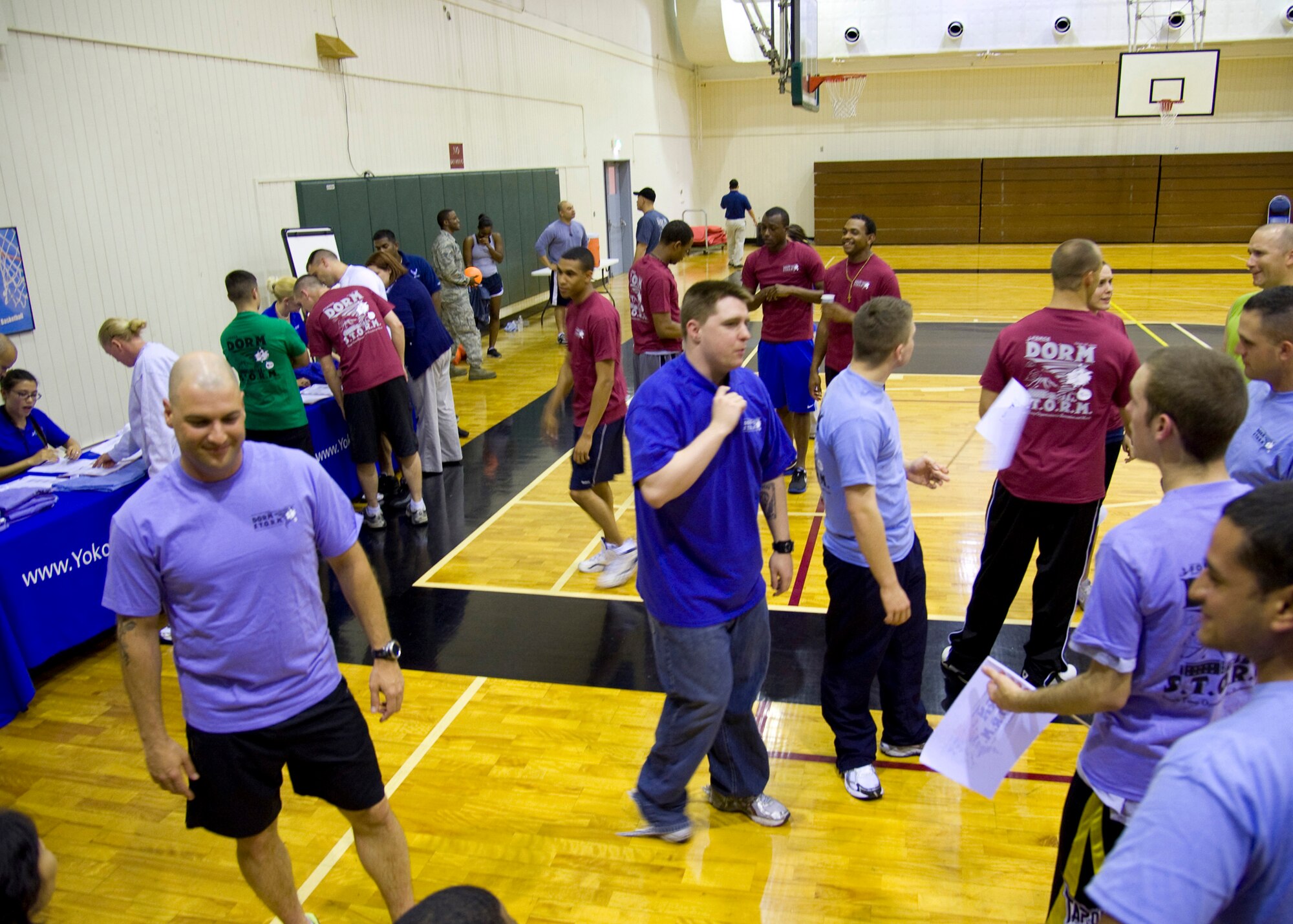 YOKOTA AIR BASE, Japan -- Airmen and wing leadership socialize prior to a dodgeball tournament June 14, 2011, Yokota Air Base, Japan. The game was one of four events featured in the Spring 2011 Dorm STORM (Single Troop Opportunities for Recreation and Morale) hosted by the 374th Force Support Squadron. (U.S. Air Force photo/Airman 1st Class Krystal Garrett)