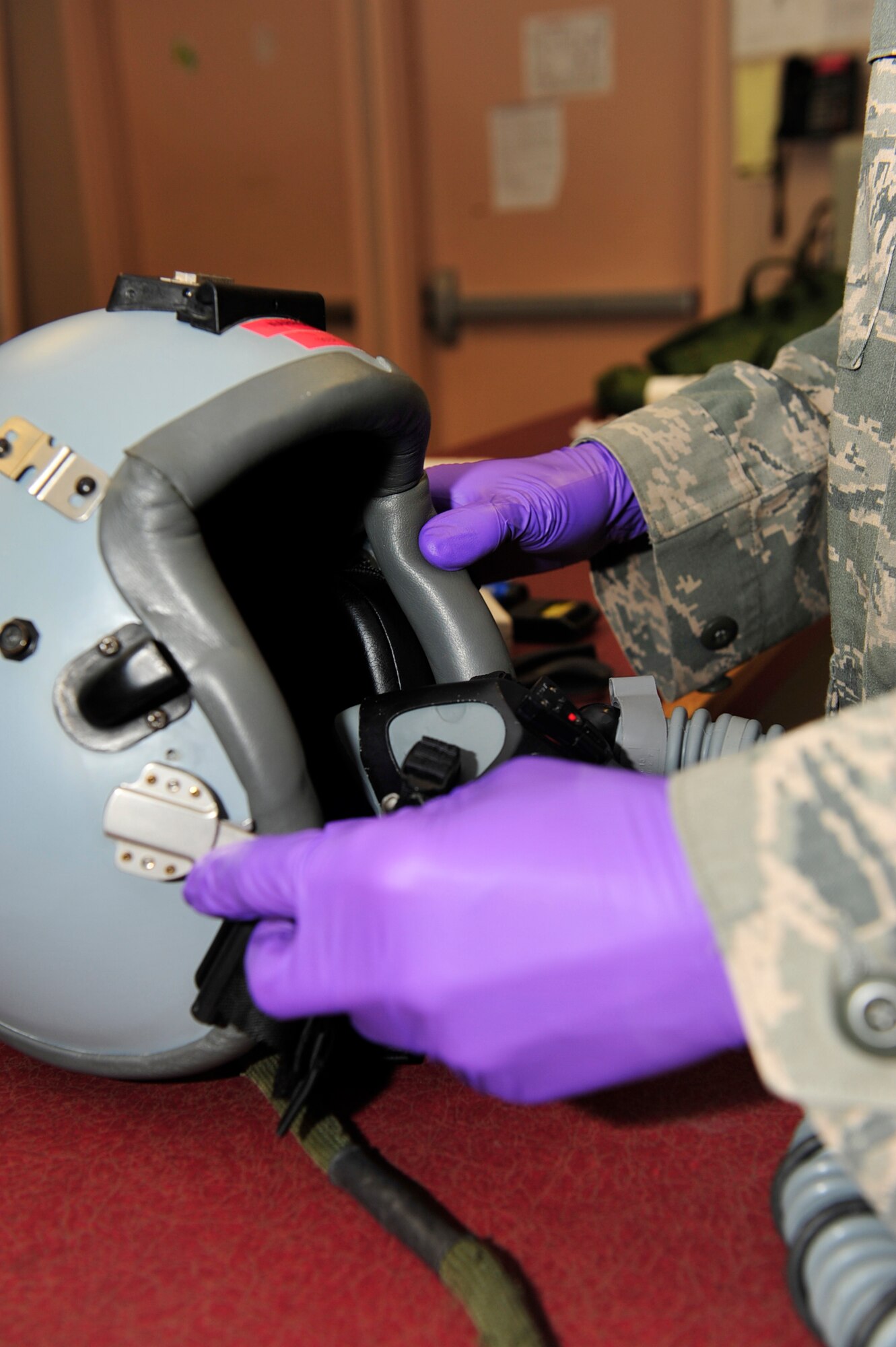 United States Air Force Staff Sgt. Nathan Davis, an aircrew flight equipment technician with the 18th Operations Support Squadron, Kadena Air Force Base, Japan, conducts a periodic inspection on an HGU-55P helmet during the Northern Edge Premier Joint Training Exercise, at Eielson Air Force Base, Alaska, June 21. More than 1,000 personnel have been deployed to Alaska for the exercise, which is taking place at the northern most Alaskan Army and Air Force installations.  (U.S. Air Force photo/Staff Sgt. Lakisha A. Croley)