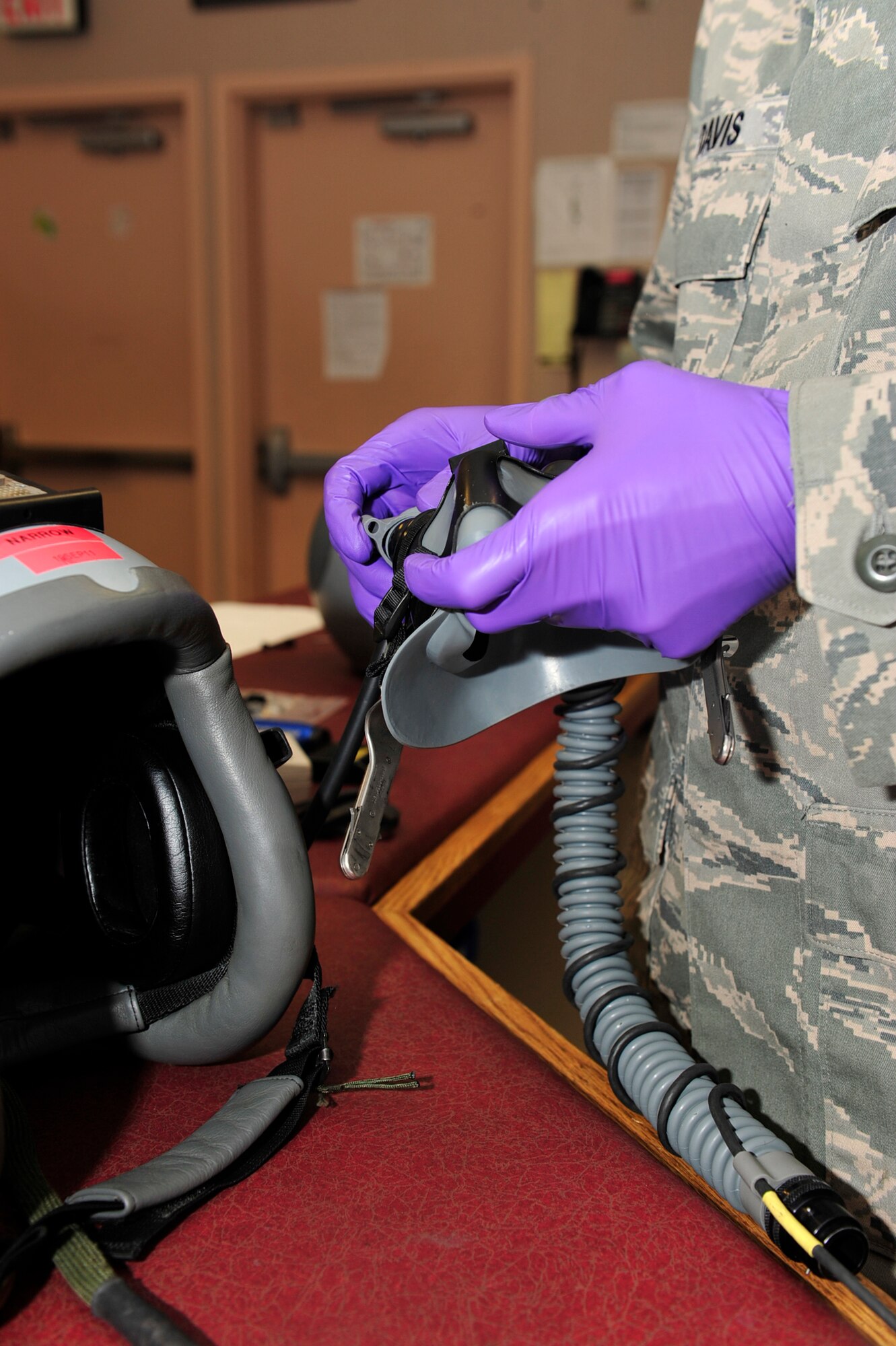 United States Air Force Staff Sgt. Nathan Davis, an aircrew flight equipment technician with the 18th Operations Support Squadron, Kadena Air Force Base, Japan, conducts a periodic inspection on an HGU-55P helmet during the Northern Edge Premier Joint Training Exercise, at Eielson Air Force Base, Alaska, June 21. More than 6,000 active duty, Reserve and National Guard personnel are participating in Northern Edge 2011. (U.S. Air Force photo/Staff Sgt. Lakisha A. Croley)