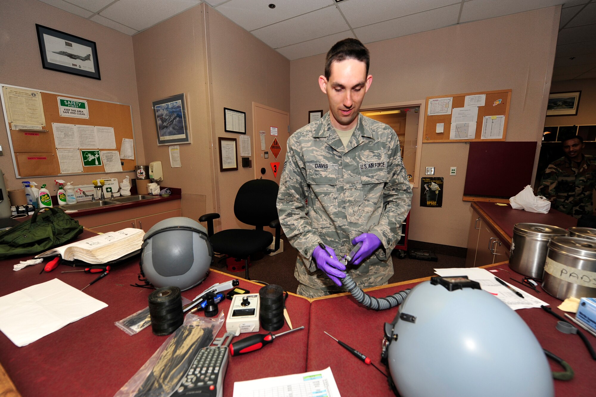United States Air Force Staff Sgt. Nathan Davis, an aircrew flight equipment technician with the 18th Operations Support Squadron, Kadena Air Force Base, Japan, conducts a periodic inspection on an HGU-55P helmet during the Northern Edge Premier Joint Training Exercise, at Eielson Air Force Base, Alaska, June 21. Northern Edge 2011, allows military members to hone existing skills and test future productions of weapon potentials. (U.S. Air Force photo/Staff Sgt. Lakisha A. Croley)