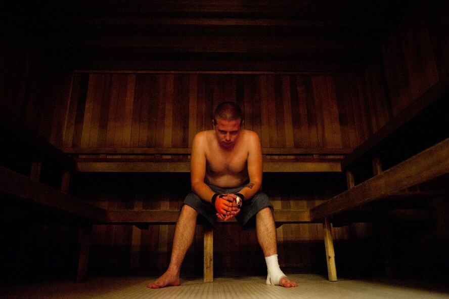 Airman 1st Class Trevor Newsome, 28th Logistics Readiness Squadron fuels distribution technician, relaxes in the sauna prior to his first official mixed martial arts fight June 17, 2011 at the Bellamy Fitness Center on Ellsworth Air Force Base, S.D. He had the chance to fight during Ring Wars, a local MMA organization that travels around South Dakota, Montana, Wyoming and Nebraska, bringing the MMA experience to fans backyards.  (U.S. Air Force photo/Tech. Sgt. Nathan Gallahan/Released)
