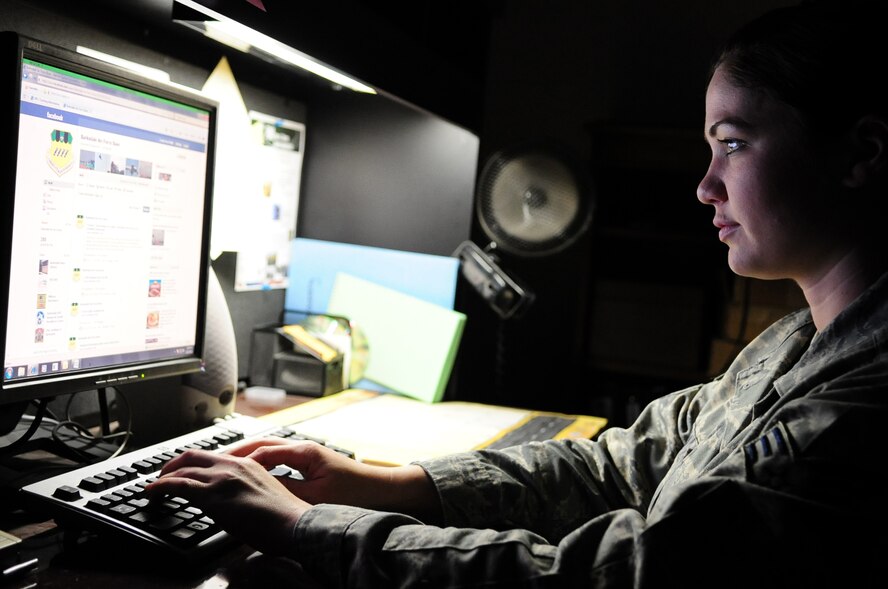 Senior Airman Allison Boehm, 2nd Bomb Wing Public Affairs journalist, updates the Barksdale Air Force Base, La., Facebook profile, June 21. The base Facebook page is updated daily with notifications, stories, photos and upcoming events. (U.S. Air Force photo/Senior Airman Joanna M. Kresge)