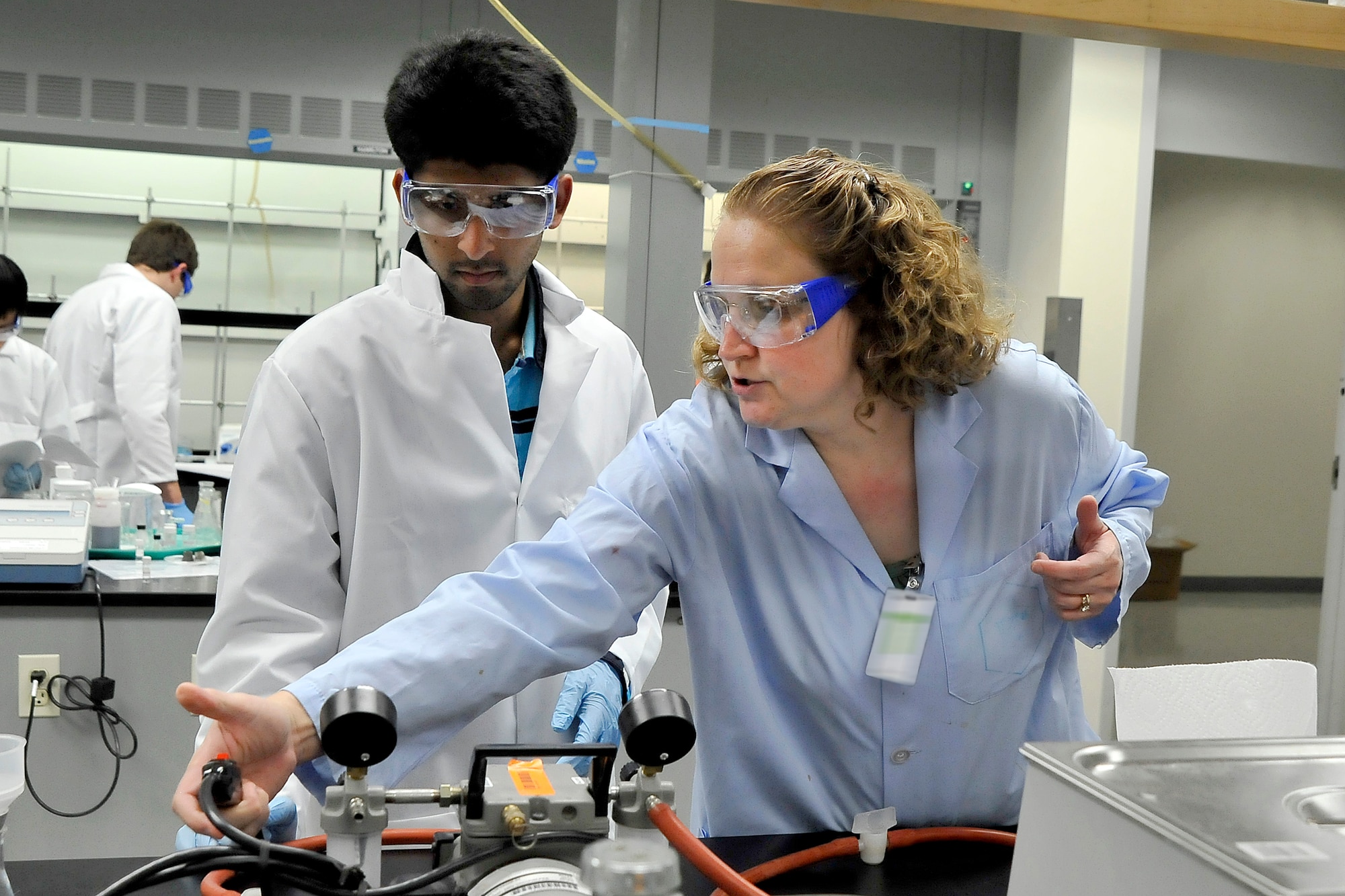 First Year Mentor Dr. Kelli Slunt works with New York native Tayyab Shah, 17, in the lab during the U.S. National Chemistry Olympiad Study Camp at the U.S. Air Force Academy. This camp has been held at the Academy  every year since 1983 and it prepares students for the International Chemistry Olympiad. (U.S. Air Force Photo/Megan Davis)