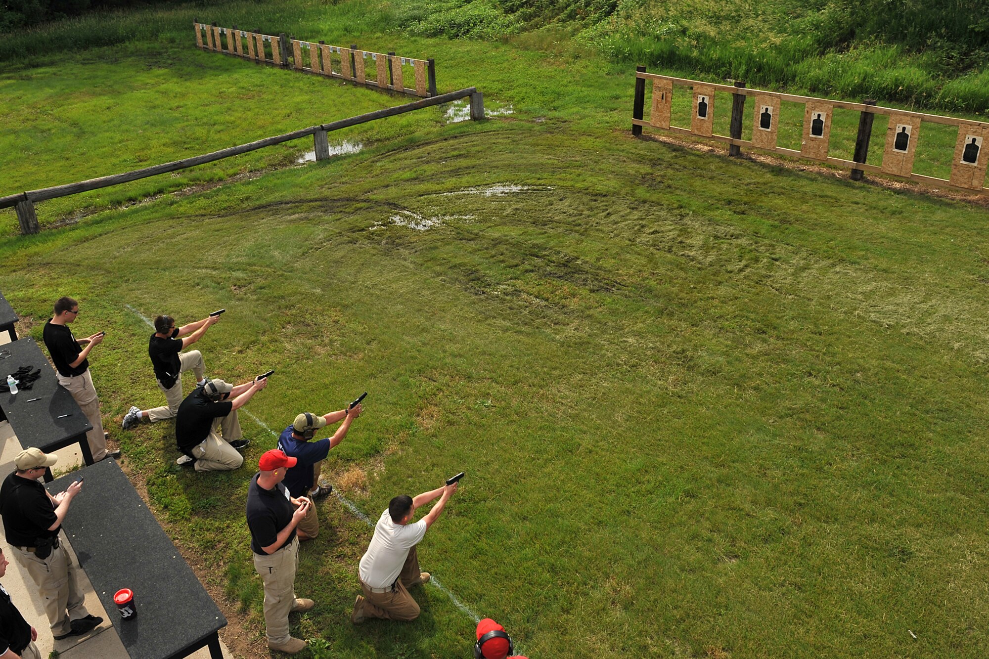 Various law enforcement agencies came together to participate in the Air Force Office of Special Investigations pistol competition held at the Bellevue Rod and Gun Club in Bellevue, Neb. June 17. They ran .6 mile, shot their weapon from the kneeling position, and also shot at various targets all participants aiming for the lowest time possible. 