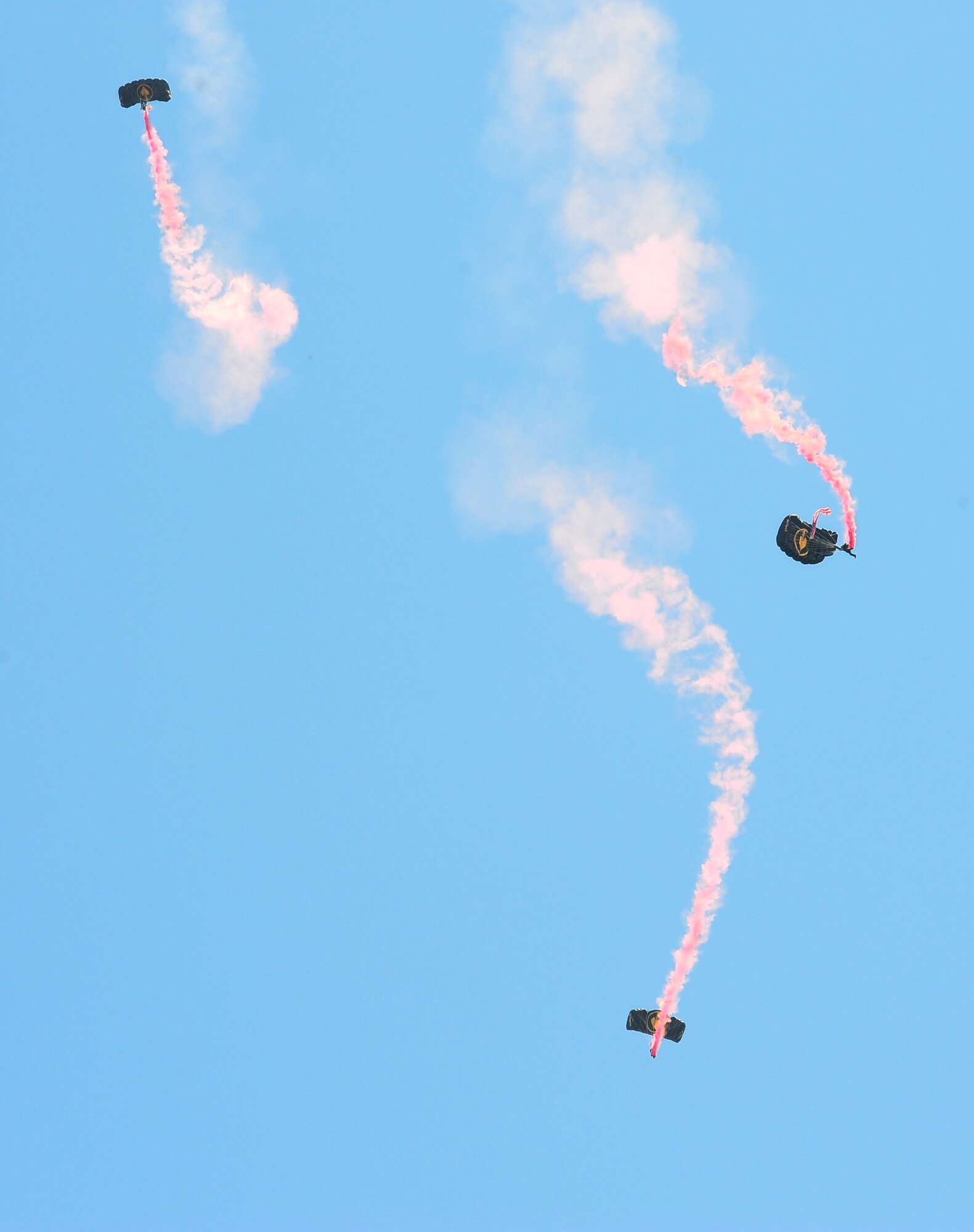 Retired Lt. Col. Keith Walter, Lt. Col. Jim Bean and Retired Sgt. Maj. Russ McDaniel, members of the United States Special Operations Command Parachute Team, The Para-Commandos, descend toward the 1st Special Forces Group Reunion memorial service held, at MacDill Air Force Base, Fla., June 20, 2011. Sergeant Major McDaniel flew the POW/MIA flag behind him during the descent which was presented to former prisoner of war Isaac “Ike” Camacho. (U.S. Air Force photo by Airman Basic David Tracy)