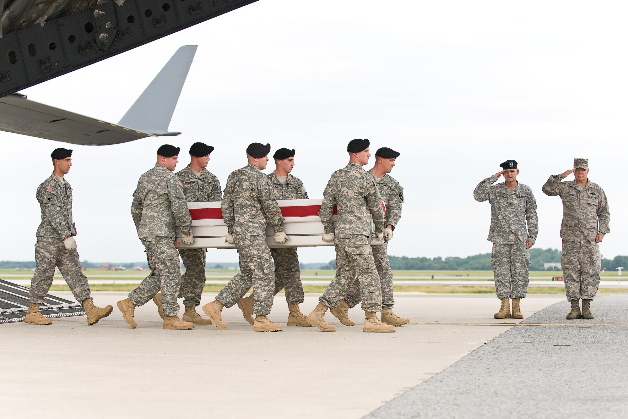 A U.S. Army carry team transfers the remains of Army Pfc. Brian J. Backus, of Saginaw Township, Mich., at Dover Air Force Base, Del., June 21, 2011. Backus was assigned to the 2nd Battalion, 87th Infantry Regiment, 3rd Brigade Combat Team, 10th Mountain Division, Fort Drum, N.Y. (U.S. Air Force photo/Roland Balik)