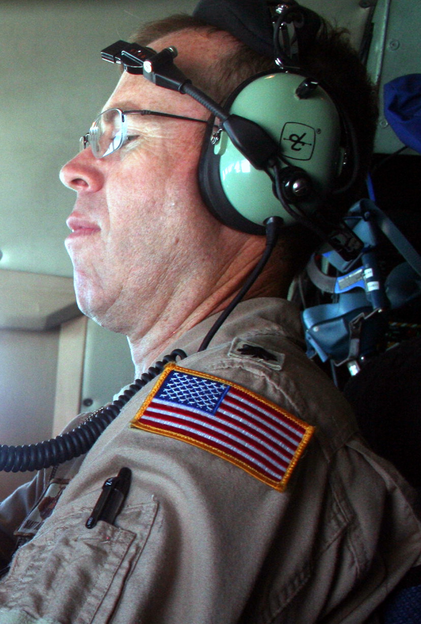 Lt. Col. Matthew Ahern, C-5 pilot, works in a C-5M Super Galaxy during a mission on June 5, 2011. The plane was flying the Air Force's first direct delivery airlift mission through the Arctic Circle from Dover Air Force Base, Del., to Bagram Airfield, Afghanistan. Colonel Ahern is with the 9th Airlift Squadron at Dover AFB.  (U.S. Air Force Photo/Master Sgt. Scott T. Sturkol)