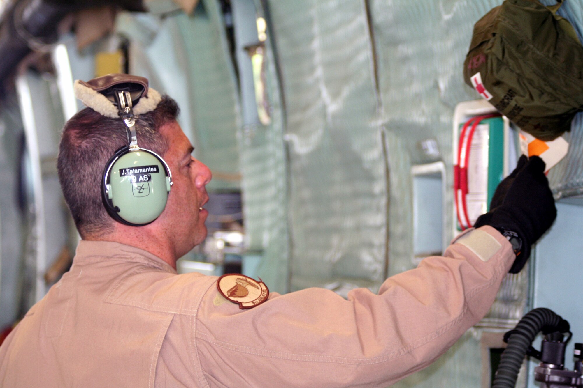 Tech. Sgt. Jesse Talamantes, C-5 flight engineer, works nb a checklist for a C-5M Super Galaxy at bagram Airfield, Afghanistan, on June 5, 2011. Sergeant Talamantes was one of the crew members who flew on a mission that was the Air Force's first direct delivery airlift mission through the Arctic Circle from Dover Air Force Base, Del., to Bagram Airfield, Afghanistan. CSergeant Talamantes is from the 9th Airlift Squadron at Dover AFB and his hometown is Long Beach, Calif.  (U.S. Air Force Photo/Master Sgt. Scott T. Sturkol)
