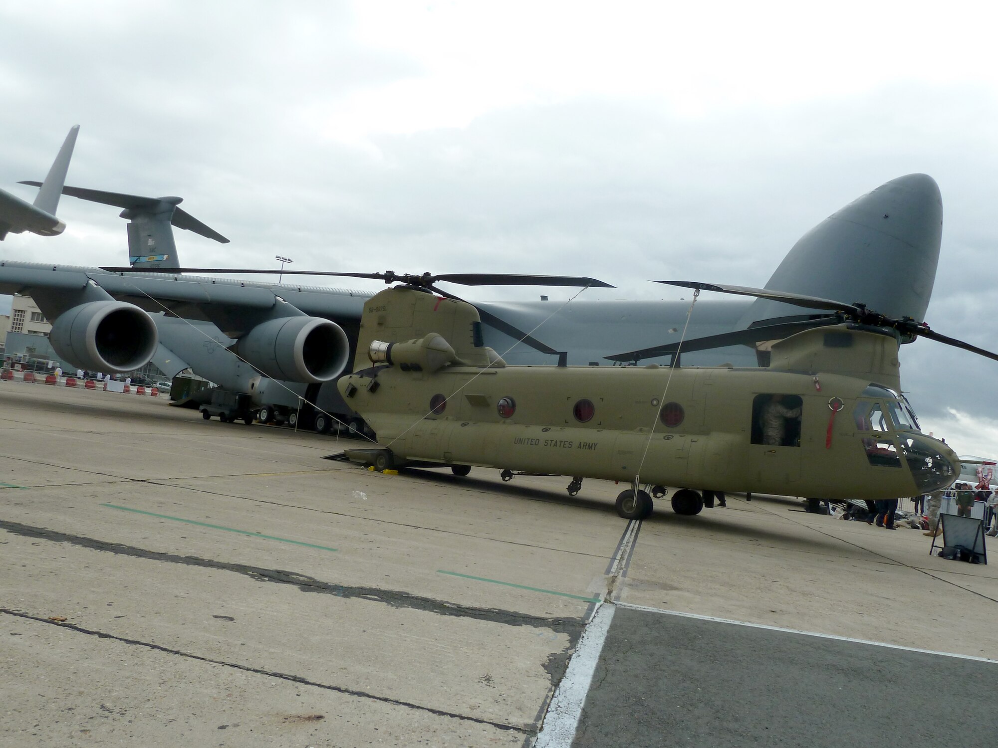 An Army CH-47F Chinook and an Air Force C-5M Super Galaxy are two of the 11 U.S. aircraft on display during the 49th International Paris Air Show at the Le Bourget Airport in Paris. (U.S. Air Force photo/Tech. Sgt. Francesca Popp)