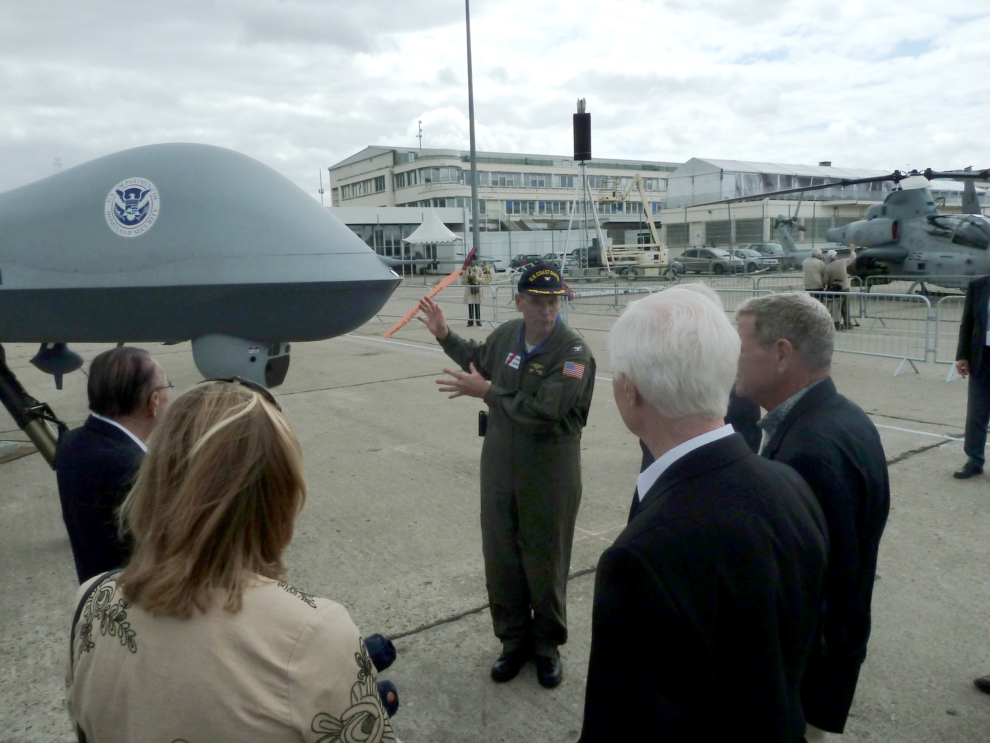 U.S. Coast Guard Capt. James Sommer explains the role of the MQ-9 Predator B (Guardian) unmanned aerial system to a Congressional delegation June 19, 2011, during the 49th International Paris Air Show at the Le Bourget Airport in Paris. The Predator B (Guardian) is operated by the U.S. Customs and Border Protection and the U.S. Coast Guard for the Department of Homeland Security. (U.S. Air Force photo/Tech. Sgt. Francesca Popp)