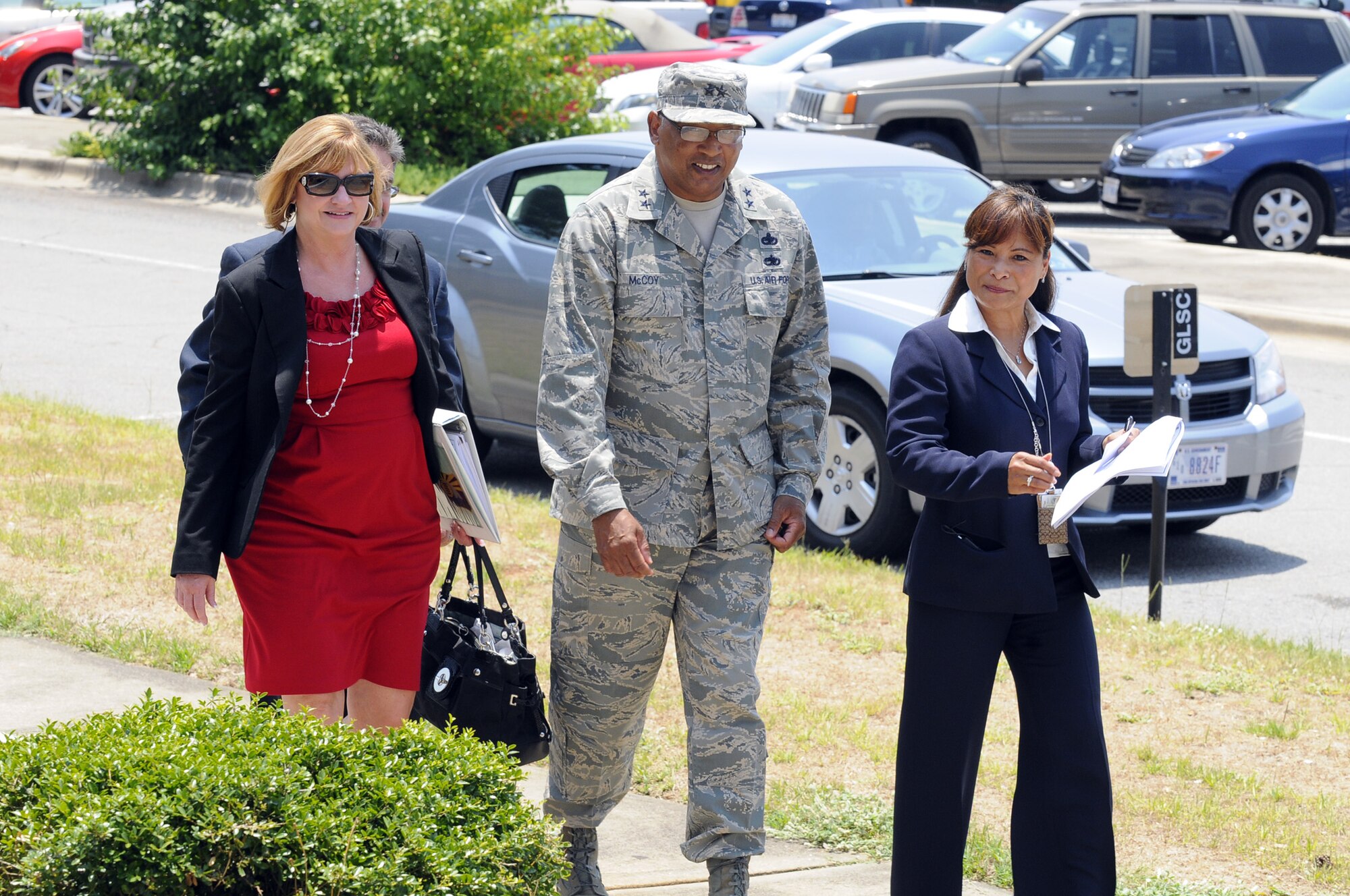 Maj. Gen.Gary T. McCoy (center) walks with Bonnie Jones and Susan Agustine during his visit to Robins. U. S. Air Force photo by Sue Sapp
