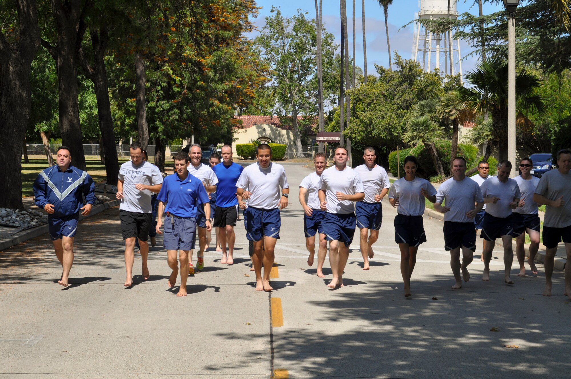 A group of Airmen try barefoot running  Dr. Mark Cucuzzella during a running clinic June 12, 2011, at March Air Reserve Base, Calif. The clinic was a joint effort between the 452nd Air Mobility Wing and the March Fitness and Inspiration Through Teamwork organization. (U.S. Air Force photo/Staff Sgt. Kevin Chandler)