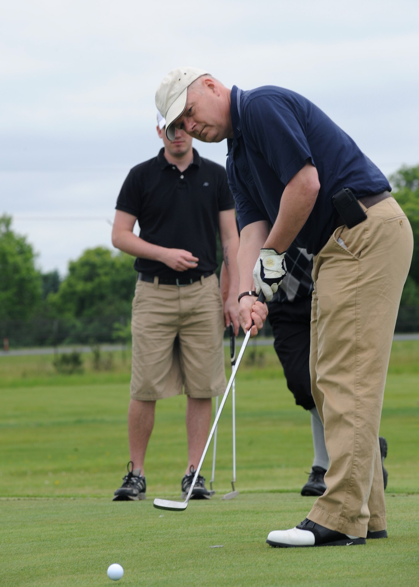 Col. Scott Rizer, 319th Air Base Wing vice commander, hits the ball during the Military Affairs Committee Golf Tournament June 20, 2011, on Grand Forks Air Force Base, N.D. The tournament is held annually to support and strengthen the relationship between the Base and the community. (U.S. Air Force photo by Senior Airman Amber Bennett)
