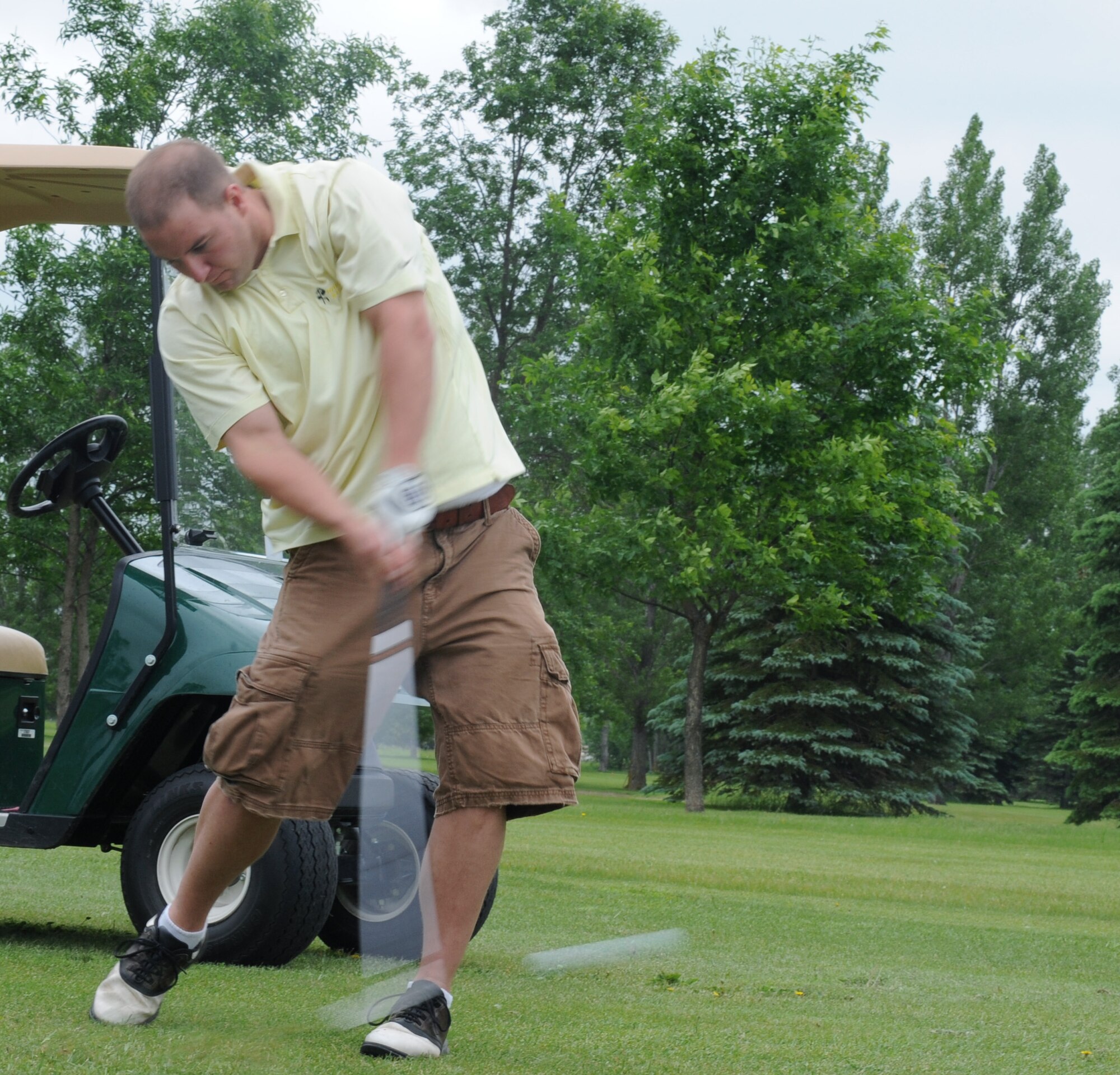 Staff Sgt. Joseph Lipske, 319th Operations Support Squadron, hits the ball during the Military Affairs Committee Golf Tournament June 20, 2011, on Grand Forks Air Force Base, N.D. The tournament is held annually to support and strengthen the relationship between the base and the community. (U.S. Air Force photo by Senior Airman Amber Bennett)