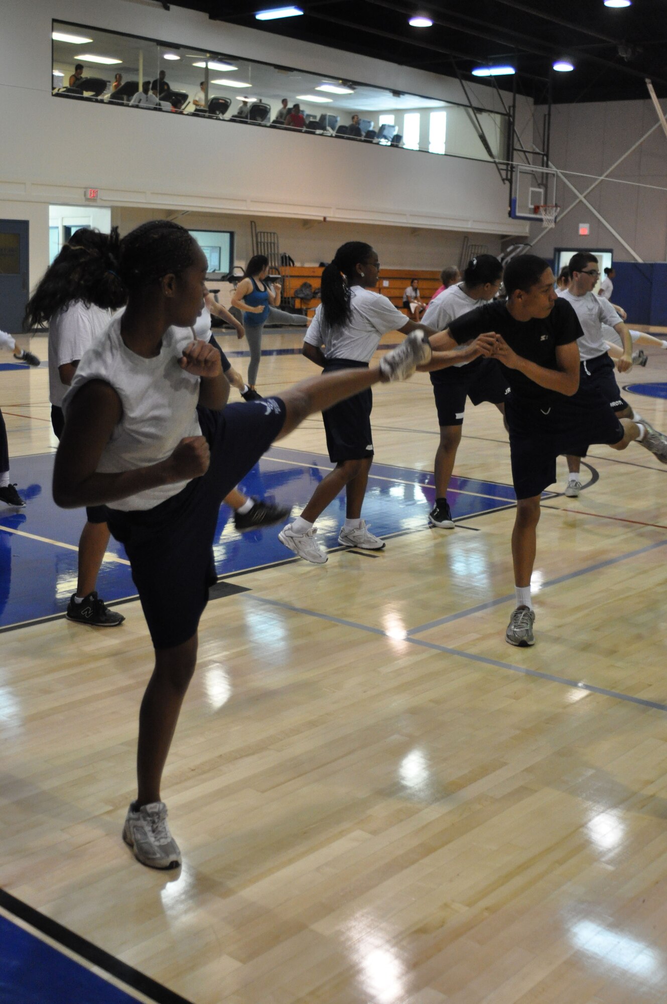 Cadet Tamiah Denson performs an impressive kick during a kickboxing class at the fitness center at March Air Reserve Base, Calif., June 15, 2011. Approximately 50 cadets from Rancho Verde High School in Moreno Valley, Calif., and Arlington High School in Riverside, Calif., participated in the two-week summer leadership school this year. (U.S. Air Force photo/Megan Just)