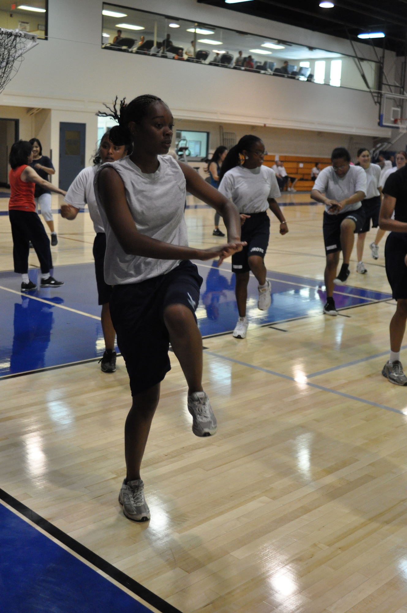 Cadet Tamiah Denson tries to keep pace during a kickboxing class at the fitness center at March Air Reserve Base, Calif., June 15, 2011. Approximately 50 cadets from Rancho Verde High School in Moreno Valley, Calif., and Arlington High School in Riverside, Calif., participated in the two-week summer leadership school this year. (U.S. Air Force photo/Megan Just)