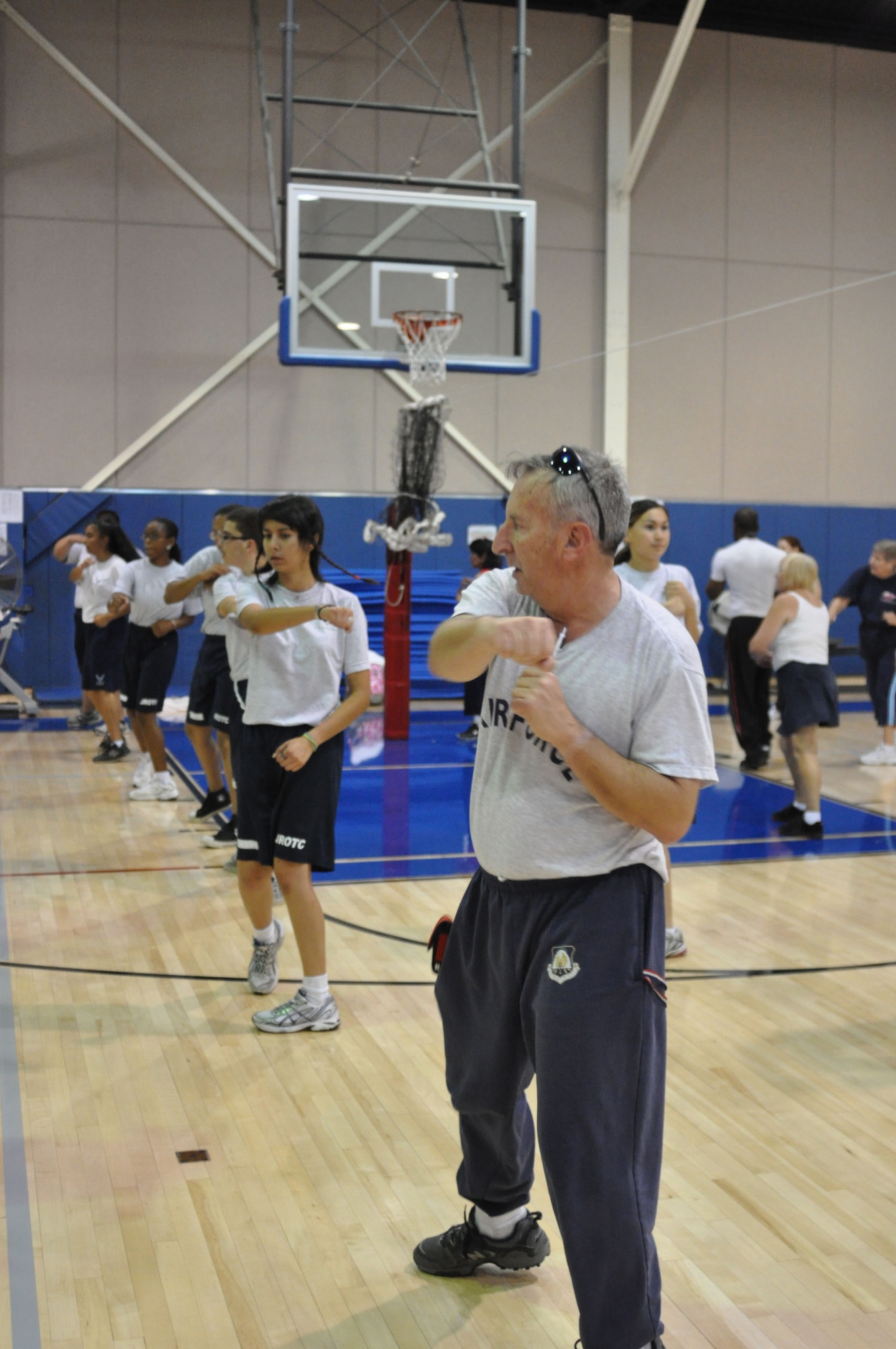 Retired Air Force Capt. Jeffrey Stein sets the example for the high school JROTC students during a kickboxing class at the fitness center at March Air Reserve Base, Calif., June 15, 2011. Captain Stein is the senior Aerospace Science instructor at Rancho Verde High School in Moreno Valley, Calif. (U.S. Air Force photo/Megan Just)