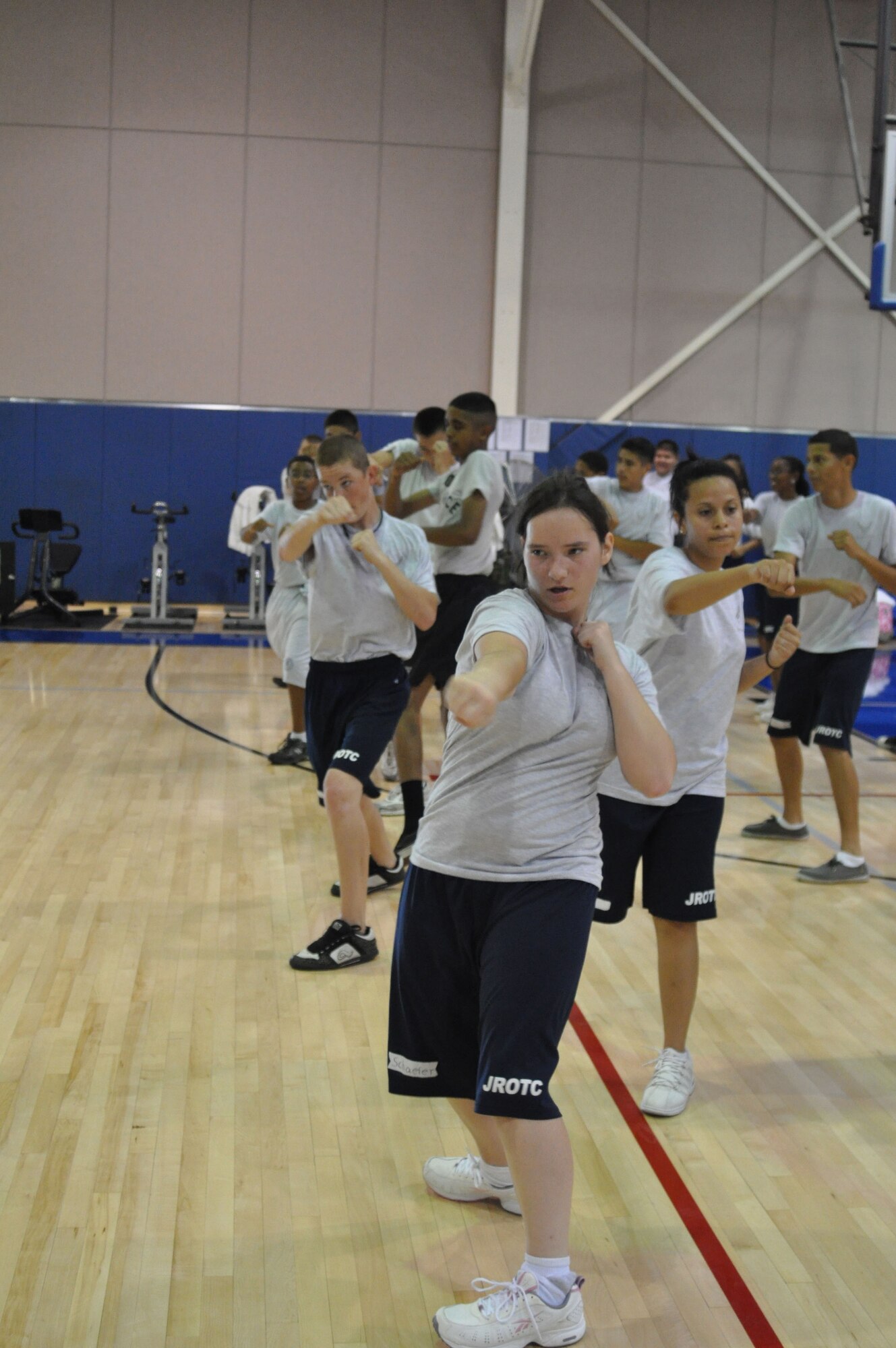 Cadet 1st Lt. Crystal Schaefer punches to the side during a kickboxing class at the fitness center at March Air Reserve Base, Calif., June 15, 2011. Approximately 50 cadets from Rancho Verde High School in Moreno Valley, Calif., and Arlington High School in Riverside, Calif., participated in the two-week summer leadership school this year. (U.S. Air Force photo/Megan Just)