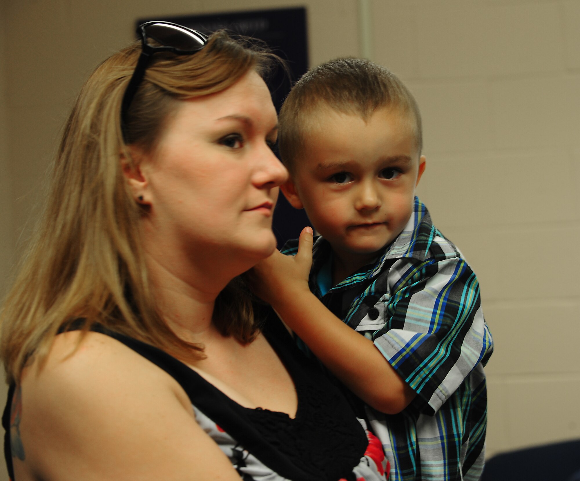 Charles Long III and his mother Erin Burgess take a tour of the 820th Combat Operations Squadron military working dog unit facility at Moody Air Force Base, Ga., June 17, 2011. Charles never met his father, U.S. Air Force Staff Sgt. Charles Long II. When he began to ask questions about him, Erin and the 820th COS arranged for him to see what his dad did before passing away in 2007. (U.S. Air Force photo by Senior Airman Stephanie Mancha/Released)