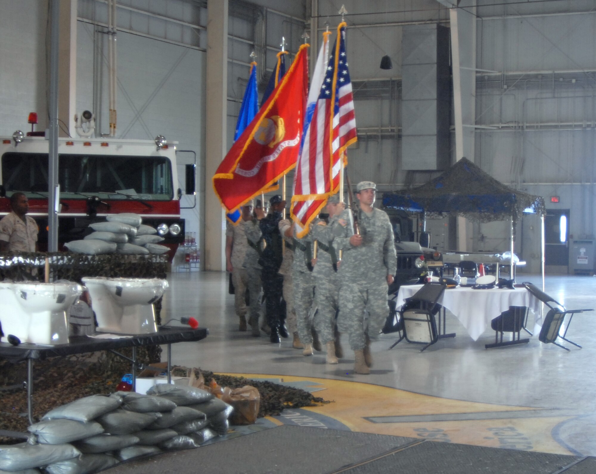 GOODFELLOW AIR FORCE BASE, Texas— Members of the Joint Service Color Guard kickoff the ceremonies at the Joint Enlisted Combat Dining In by presenting the Colors June 18. More than 300 servicemembers from the Army, Air Force, Navy and Marine Corps attended the annual event, which took place at the 312th Training Squadron High Bay. (U.S. Air Force photo/Airman 1st Class Jessica Keith)