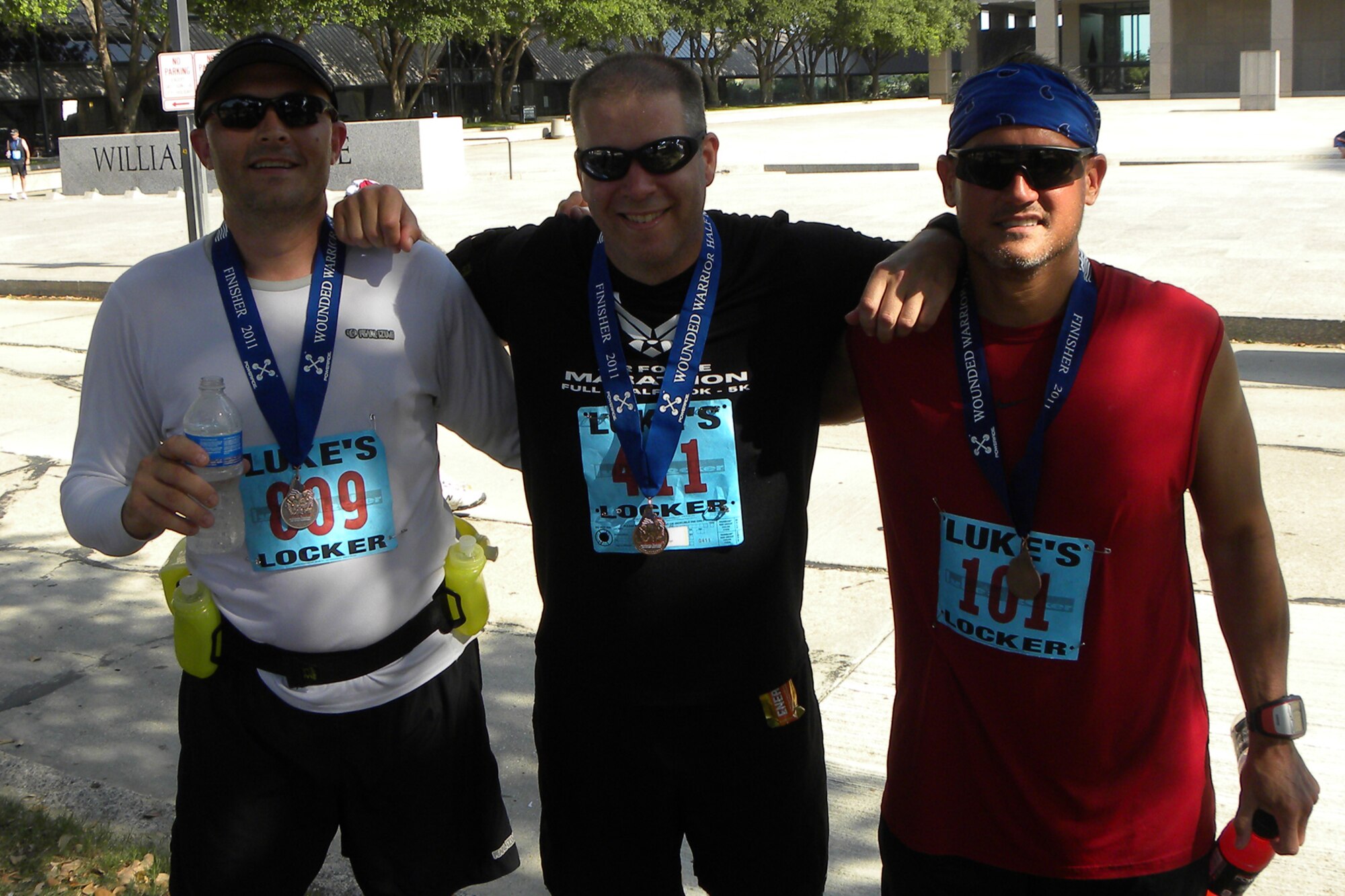 (L to R) Master Sgt. Allan Brown, electronic warfare flight chief, 307th Aircraft Maintenance Squadron, Master Sgt. John Donelson, electronic warfare technician, 307th Maintenance Squadron, and Senior Master Sgt. Stephen Robicheaux, quality assurance chief inspector, 307th MXG, strike another hero pose after completing the “Wounded Warrior Half Marathon 10K and Military Mile Fun Run” in Los Colinas, Texas, June 12, 2011. According to the Wounded Warrior website, more than 1,500 runners took part in the event to honor our men and women of the military and help raise money for the Semper Fi Fund, which provides assistance to Marines and Sailors injured in post 9-11 combat, and ReserveAid, which gives financial support to Reserve Service Members from all branches of the military. (Courtesy photo by Scott Moeller)