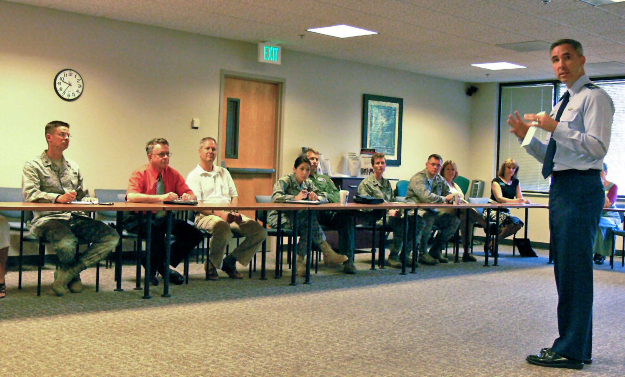 Col. Stephen N. Whiting, 21st Space Wing commander, talks with the Key Spouse Networking Group June 16, 2011, at the Peterson Airman and Family Readiness Center. Communication among the spouses, and with squadron and unit leadership, is the key to lowering stress and connecting families with programs and services. The Key Spouse Networking Group meets once a month to discuss the issues that families face during deployments, relocations, finding schools, accessing medical appointments, and more. (U.S. Air Force photo/Monica Mendoza)