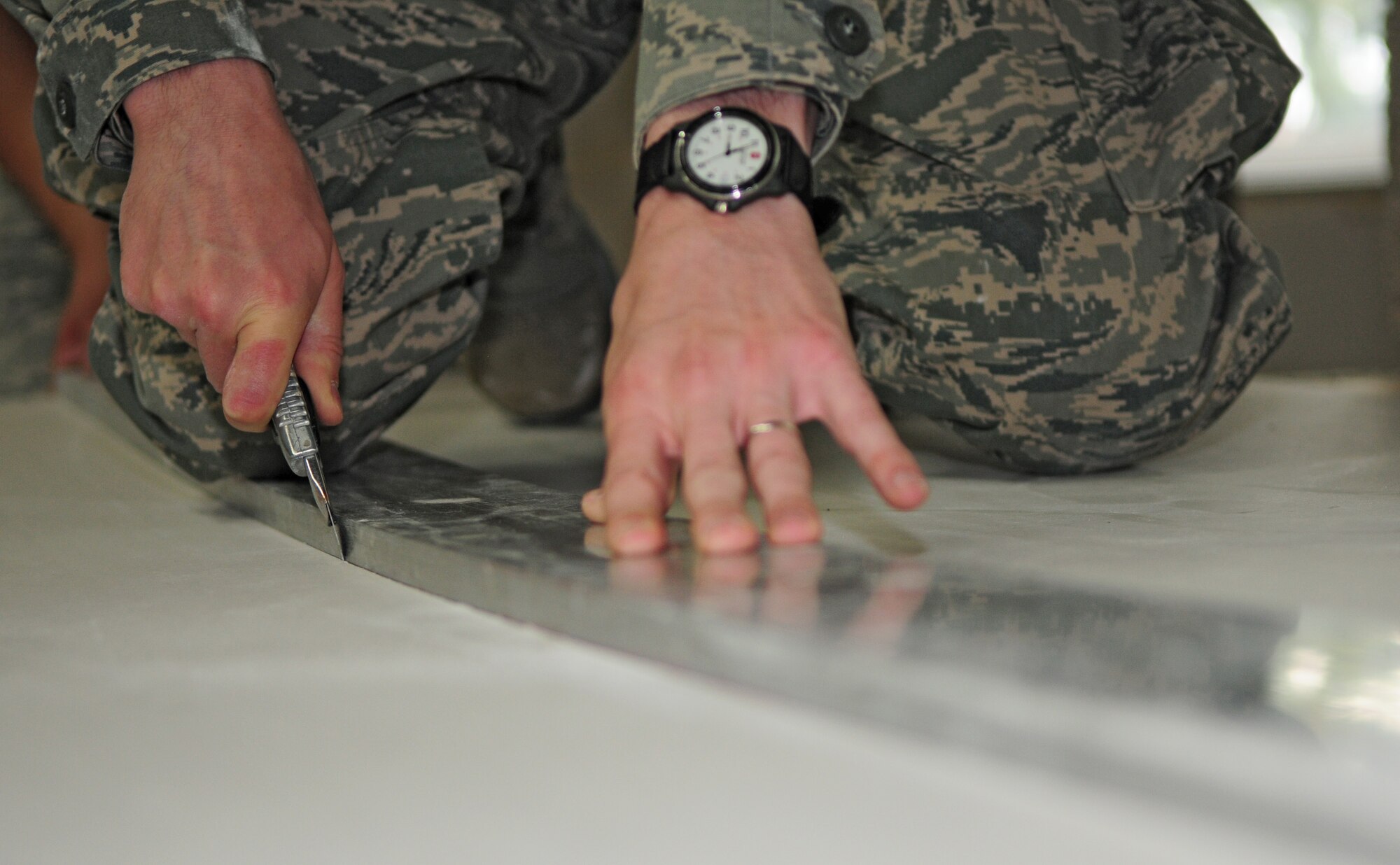 SPANGDAHLEM AIR BASE, Germany – Airman 1st Class Trent Carr, 52nd Civil Engineer Squadron structural apprentice, cuts sheetrock for a remodeling project here June 21. The structures flight within the 52nd CES is responsible for all emergency, urgent and routine work orders for carpentry, locksmithing, masonry and metalwork on Spangdahlem Air Base and 18 geographically separated units. (U.S. Air Force photo/Airman 1st Class Matthew B. Fredericks)