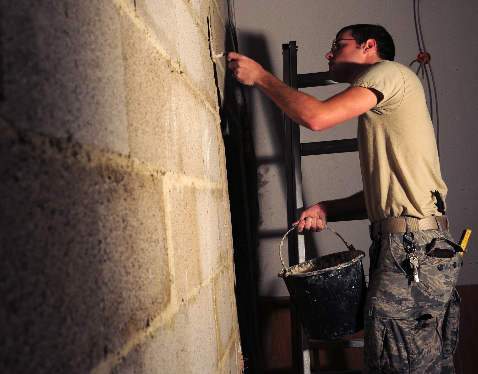 SPANGDAHLEM AIR BASE, Germany – Airman 1st Class Colt White, 52nd Civil Engineer Squadron structural apprentice, applies drywall mud while remodeling a building here June 21. The structures flight within the 52nd CES is responsible for all emergency, urgent and routine work orders for carpentry, locksmithing, masonry and metalwork on Spangdahlem Air Base and 18 geographically separated units. (U.S. Air Force photo/Airman 1st Class Matthew B. Fredericks)