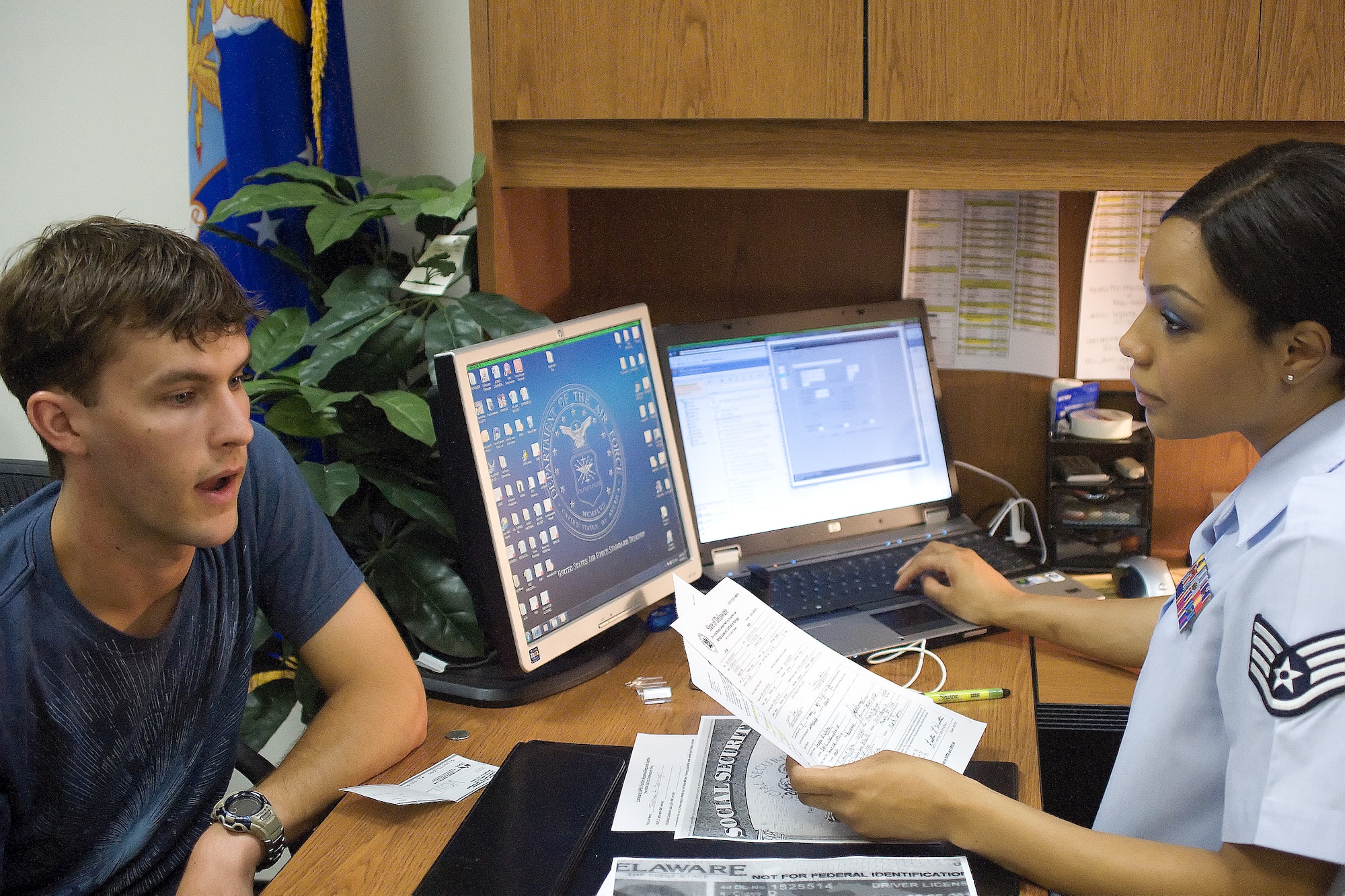 Staff Sgt. Teressa Reed (right), 314th Recruiting Squadron, briefs Airman Joshua Springer before his departure to Basic Military Training. Airman Springer is one of the dozens of Airmen Sergeant Reed has sent to BMT. (U.S. Air Force photo by Adrian Rowan)  