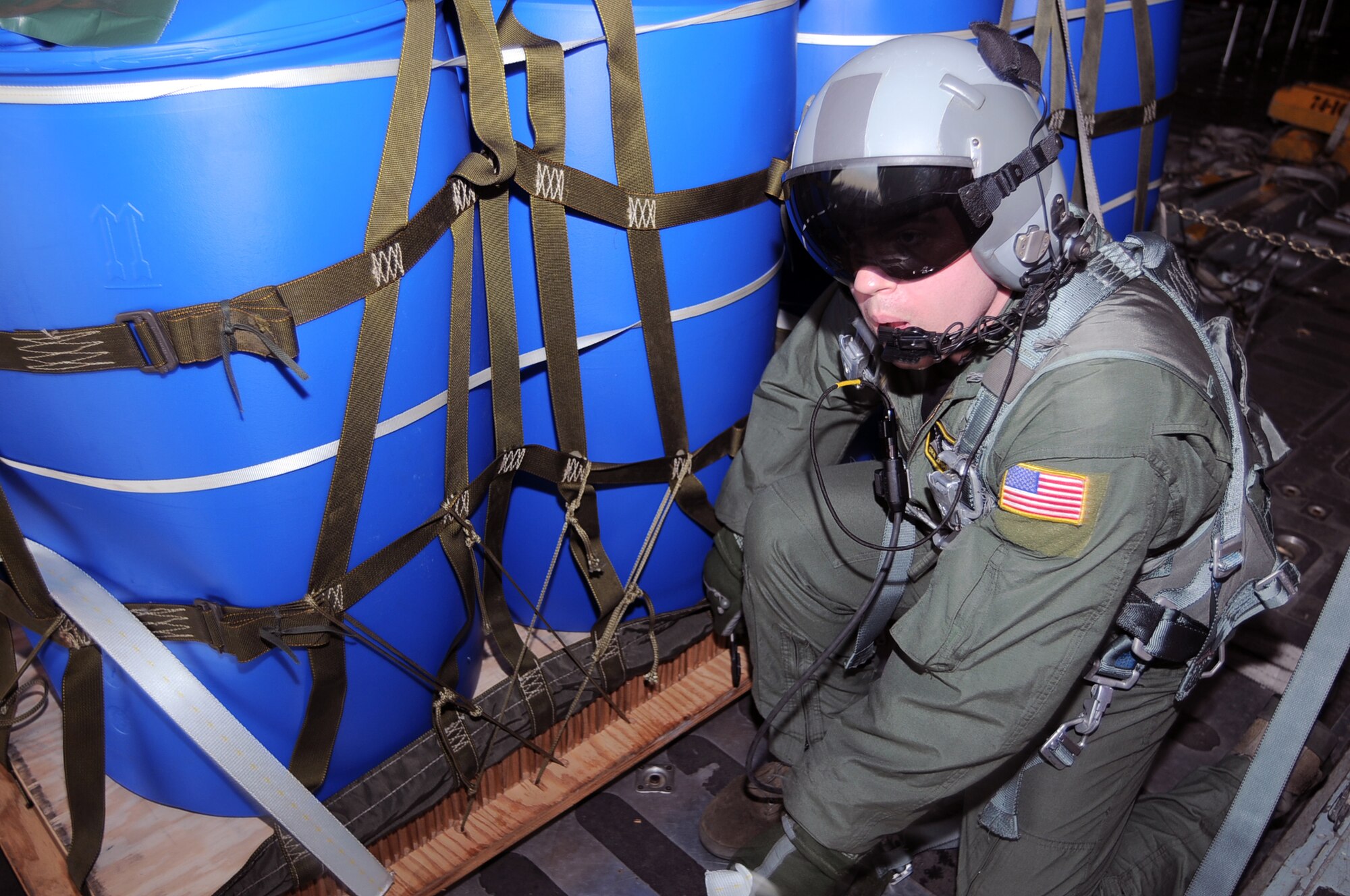 GORDA DROP ZONE, Indonesia -- Senior Airman Jason Barbieri, a loadmaster with the 36th Airlift Squadron from Yokota Air Base, Japan, releases a Container Delivery System pallet from a Yokota C-130 Hercules during Exercise Cope West 11 over the Gorda drop zone, Indonesia, June 21, 2011. Three Yokota C-130 aircraft and more than 70 Yokota airmen, as well as one Indonesian Air Force C-130 participate in this week-long bilateral field training exercise which is designed to enhance the readiness and combined interoperability between the U.S. and Indonesian Air Forces. (U.S. Air Force photo/Capt. Raymond Geoffroy)
