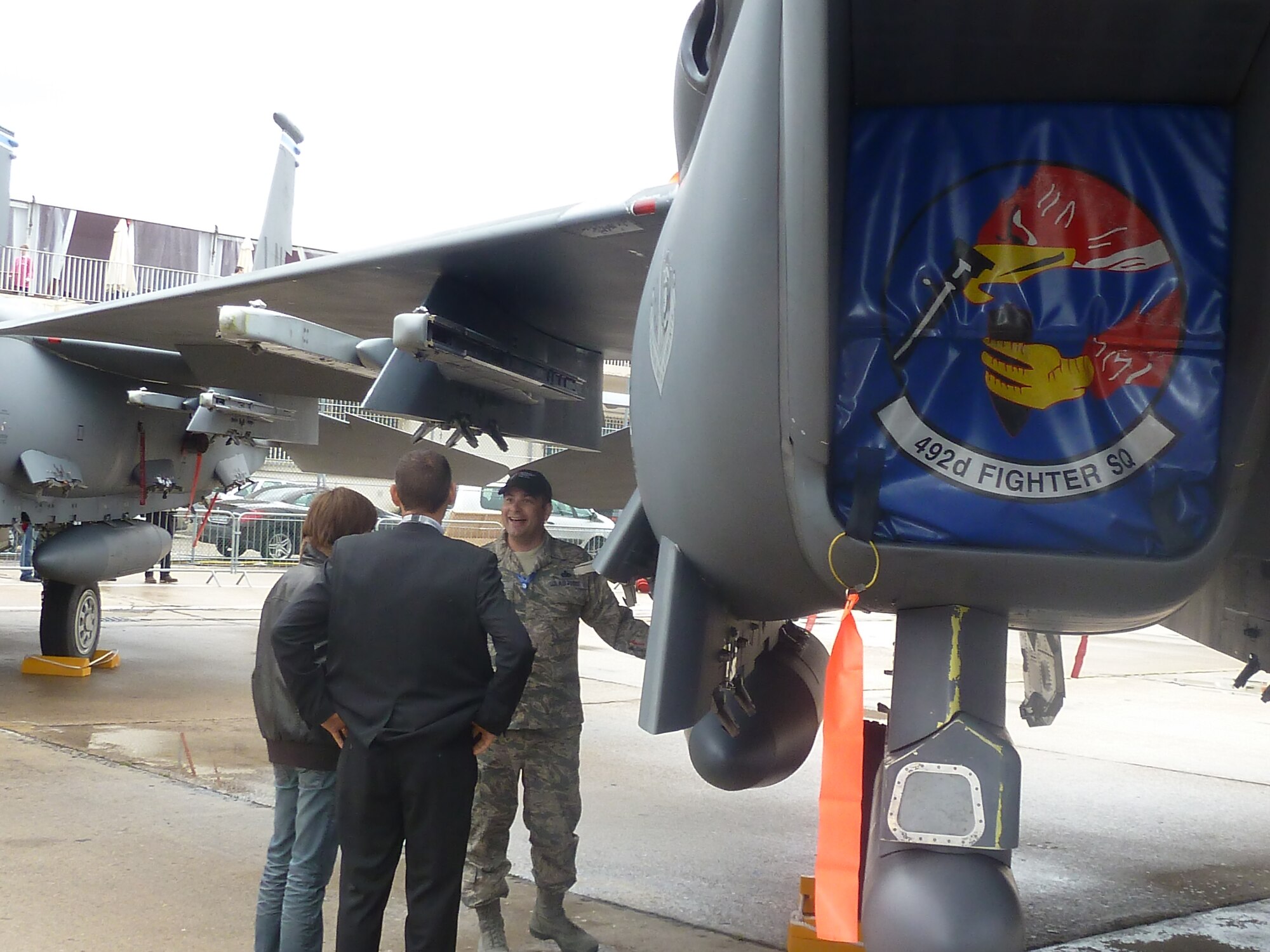 Master Sgt. Matt Larson, 48th Aircraft Maintenance Squadron, gives a tour of the F-15E Strike Eagle to visitors of the 49th International Paris Air Show, Le Bourget Airport, France, June 20. Sergeant Larson and the aircraft are assigned to RAF Lakenheath, United Kingdom. (U.S. Air Force photo/Tech. Sgt. Francesca Popp)