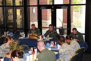 Lt. Gen. Vern "Rusty" Findley, center, speaks with Joint Base Charleston Airmen at the Gaylor Dining Facility during his visit to JB-CHS June 17. General Findley is the Air Mobility Command vice commander. (U.S. Air Force photo/Tech. Sgt. Chrissy Best)

