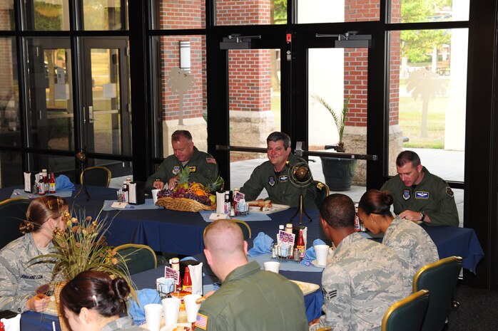 Lt. Gen. Vern "Rusty" Findley, center, speaks with Joint Base Charleston Airmen at the Gaylor Dining Facility during his visit to JB-CHS June 17. General Findley is the Air Mobility Command vice commander. (U.S. Air Force photo/Tech. Sgt. Chrissy Best)

