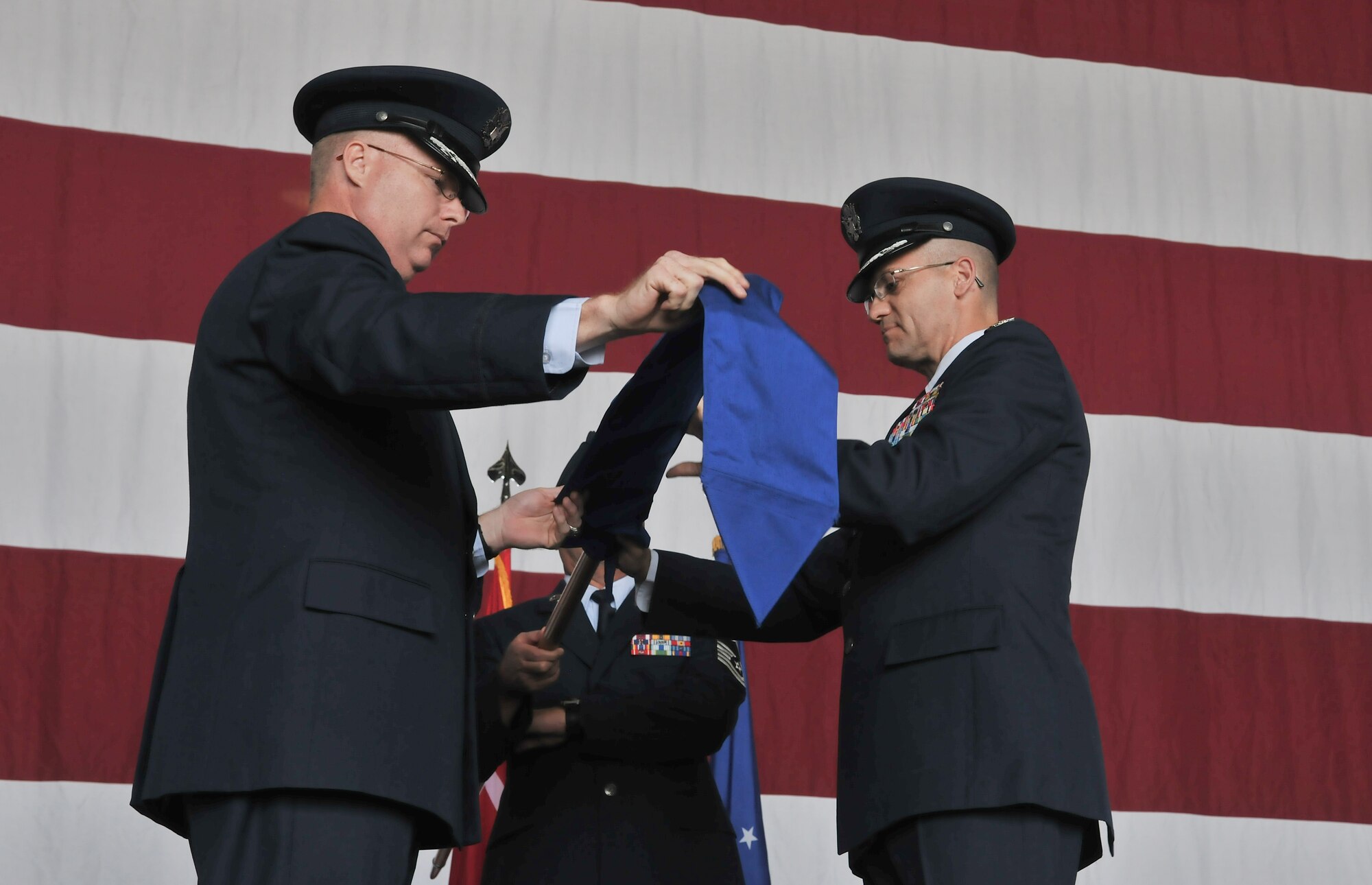 Col. Eric Beene, 39th Air Base Wing commander, and Col. Eric Gates, 39th Maintenance Group commander, retire the 39th MXG’s flag during the inactivation ceremony June 14, 2011, at Incirlik Air Base, Turkey. (U.S. Air Force photo by Staff Sgt. Alexandre Montes/Released)