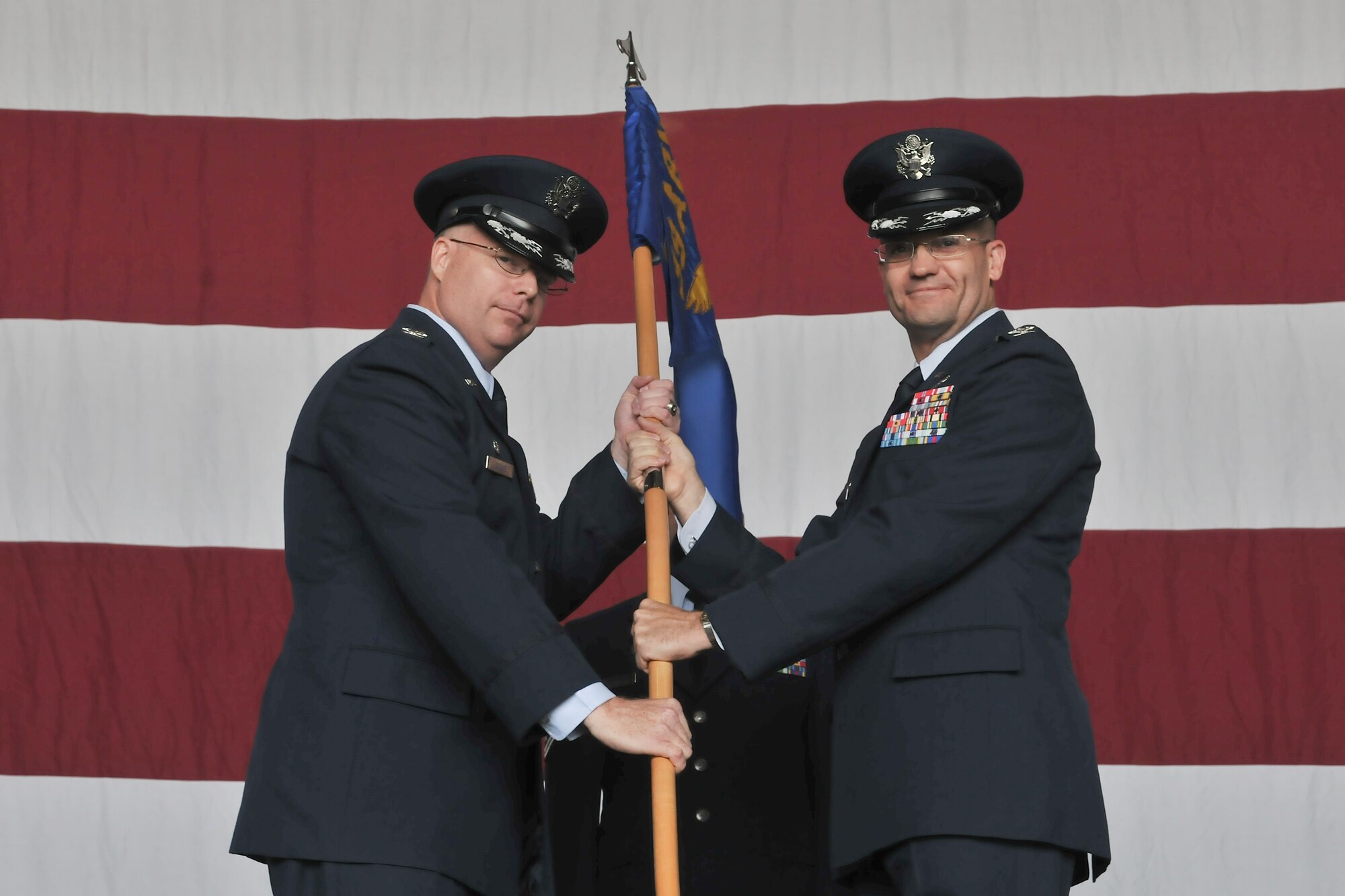 Col. Eric Beene, 39th Air Base Wing commander, receives the guidon from Col. Eric Gates, 39th Maintenance Group commander, during the 39th MXG’s inactivation ceremony June 14, 2011, at Incirlik Air Base, Turkey. (U.S. Air Force photo by Staff Sgt. Alexandre Montes/Released)
