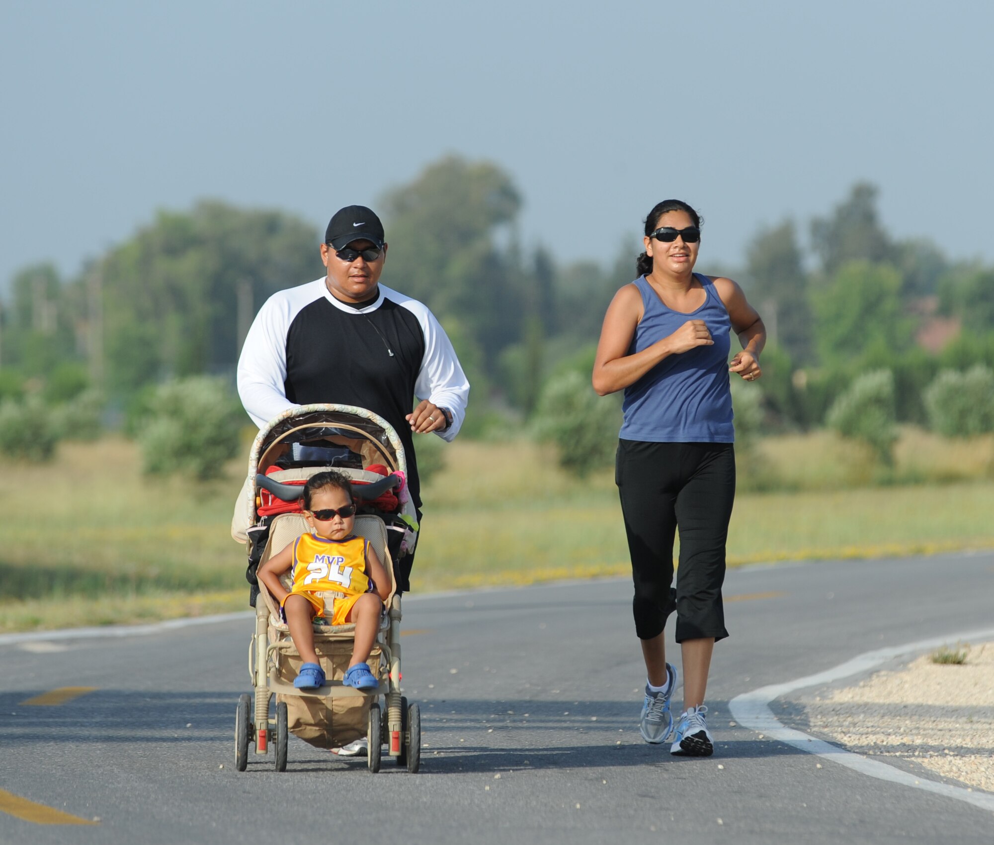 A family participates in the 5K Family Poker Run, June 11, 2011, at Incirlik Air Base, Turkey.  During the run, participants stopped at five stations around the course where they received a playing card from a standard deck of cards, and the person with the best poker hand at the end was declared the winner. (U.S. Air Force photo by Airman 1st Class Clayton Lenhardt/Released)