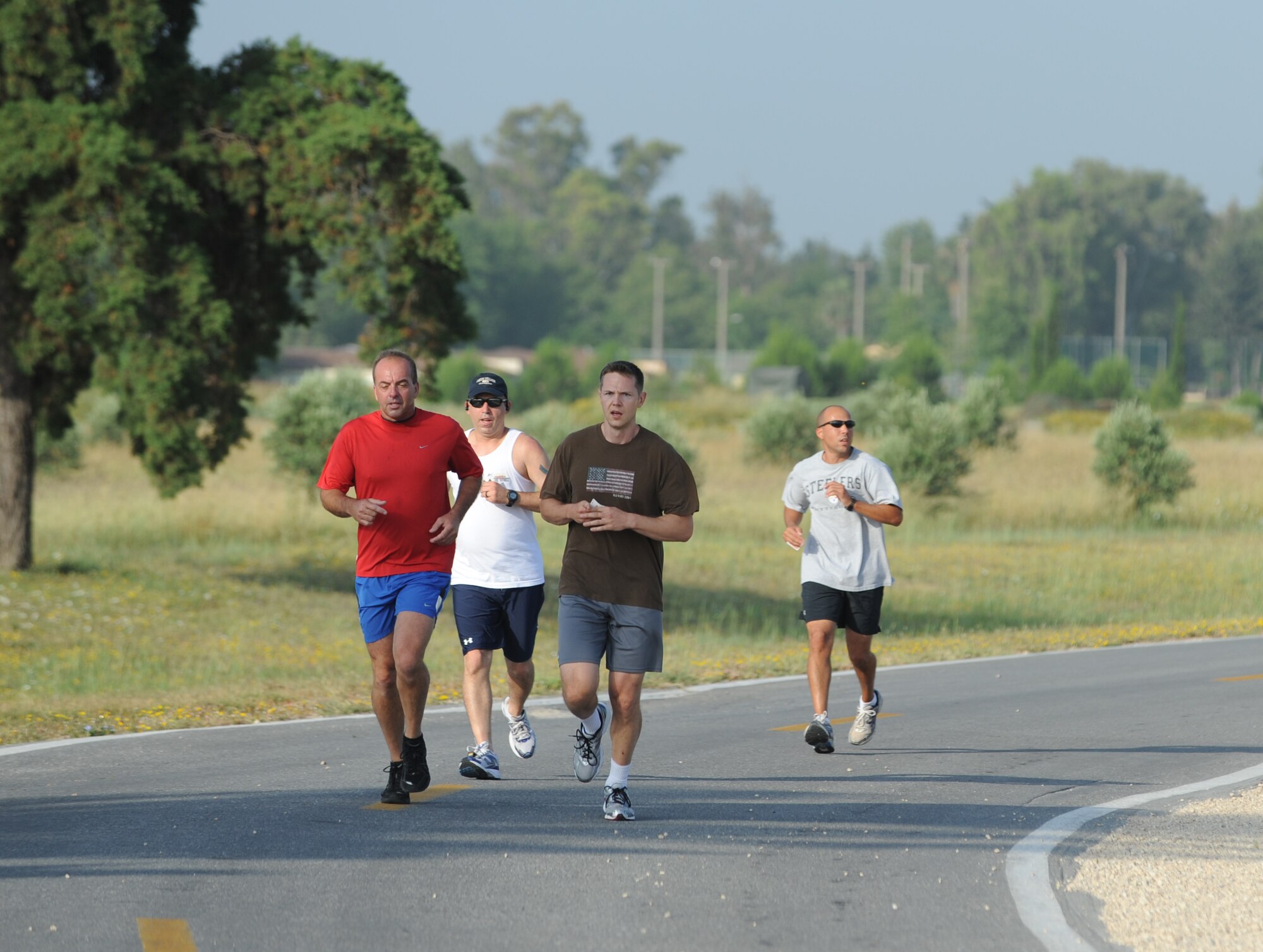 Members of Team Incirlik participate in the 5K Family Poker Run, June 11, 2011, at Incirlik Air Base, Turkey.  During the run, participants stopped at five stations around the course where they received a playing card from a standard deck of cards, and the person with the best poker hand at the end was declared the winner. (U.S. Air Force photo by Airman 1st Class Clayton Lenhardt/Released)